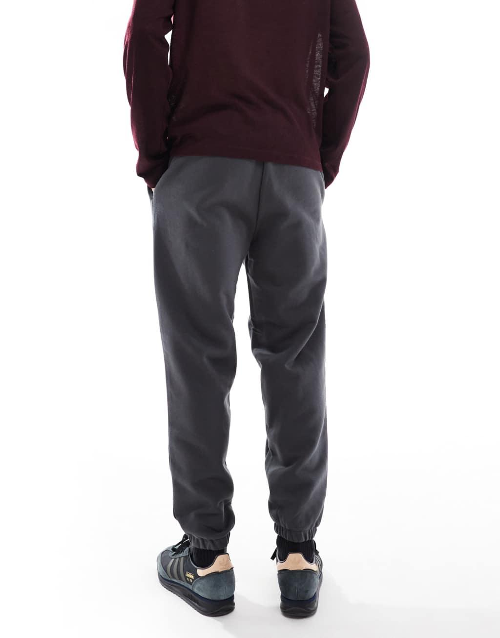 ASOS DESIGN premium heavyweight tapered sweatpants in washed black Product Image