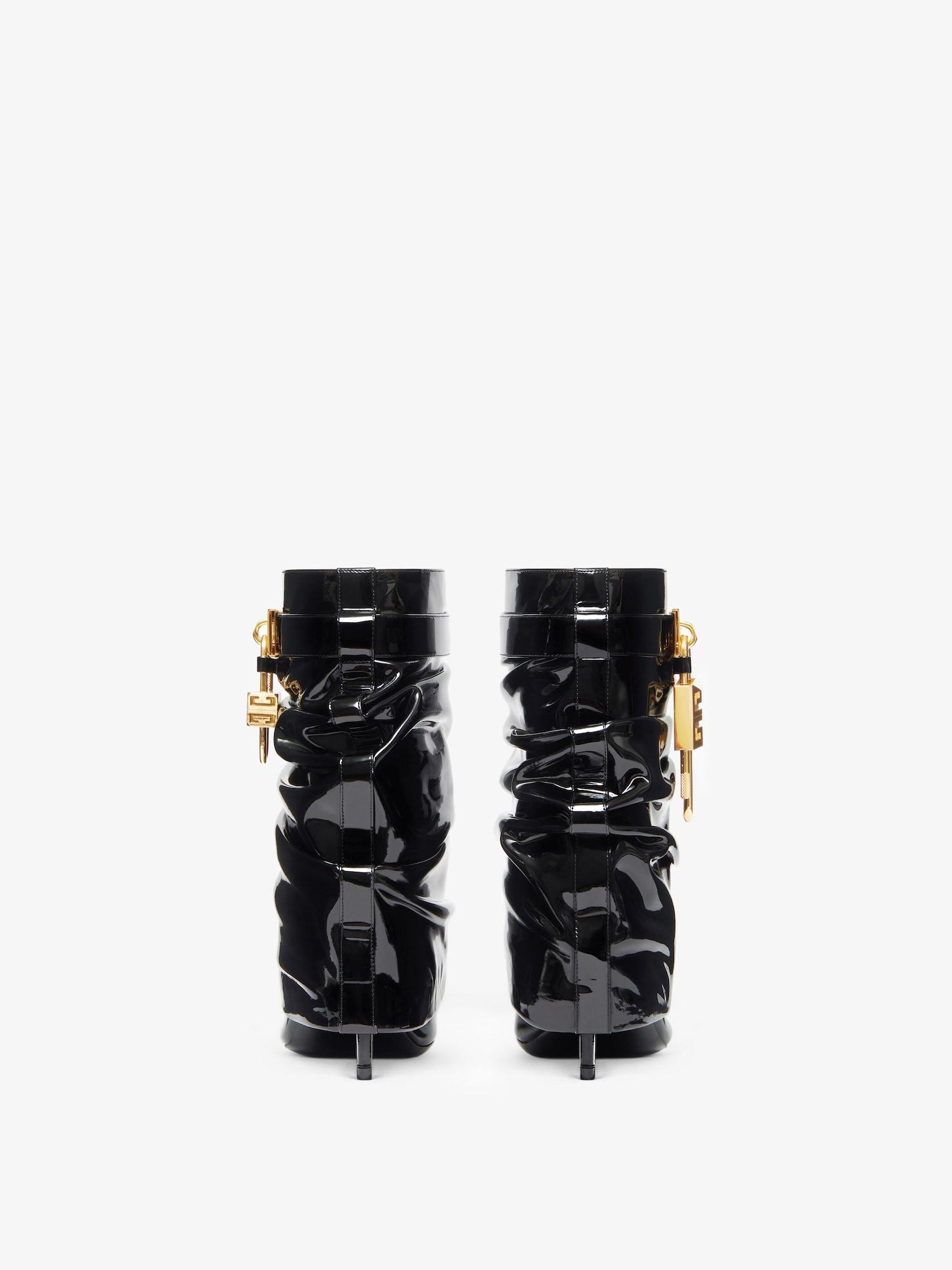 Shark Lock Stiletto ankle boots in latex Product Image