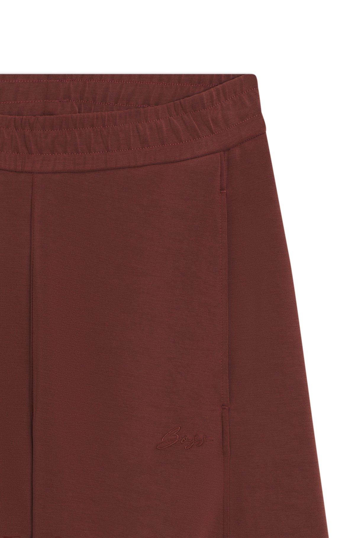 Logo-embroidery tracksuit bottoms with balloon fit Product Image