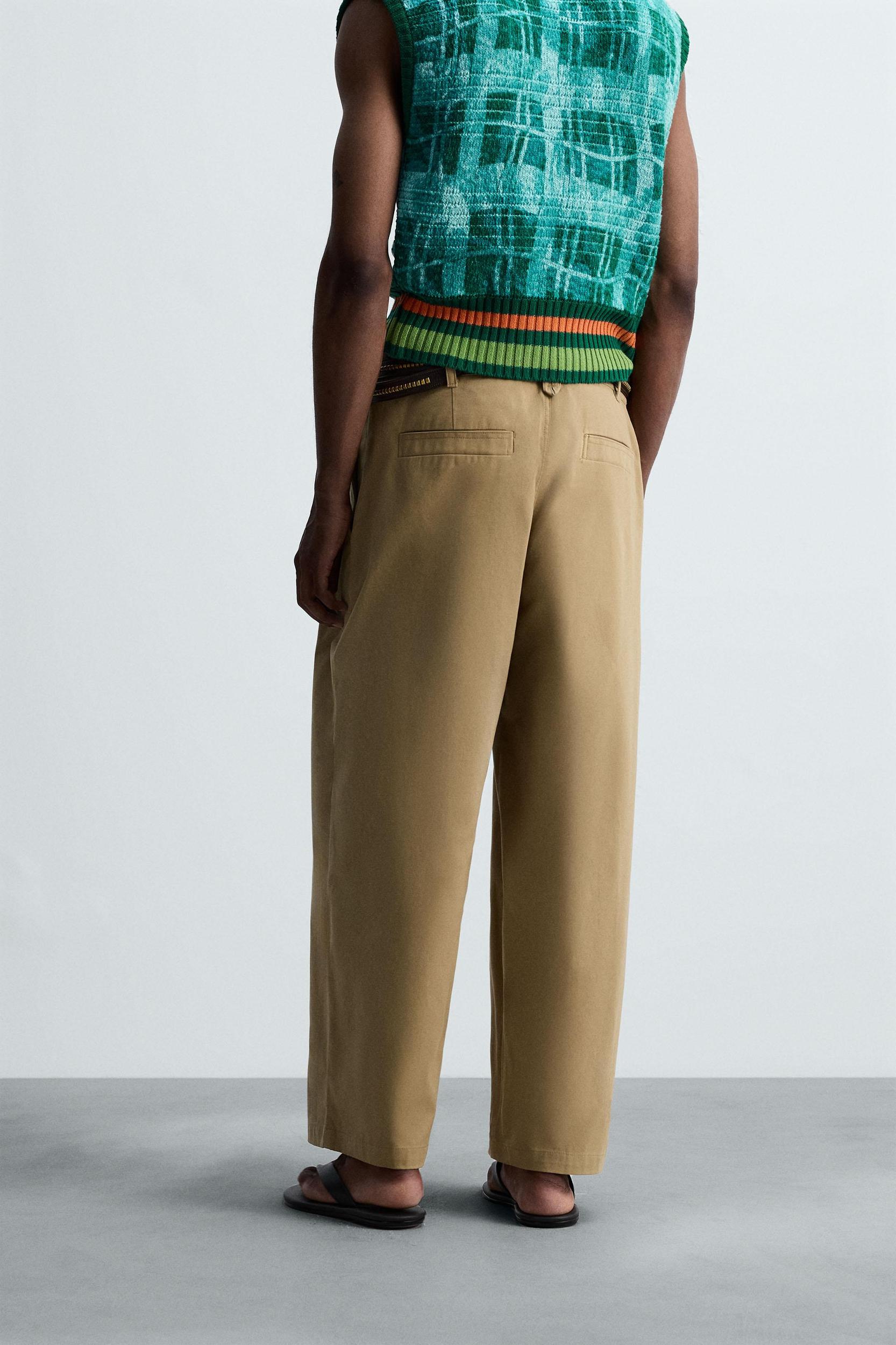 PLEATED WIDE FIT PANTS Product Image