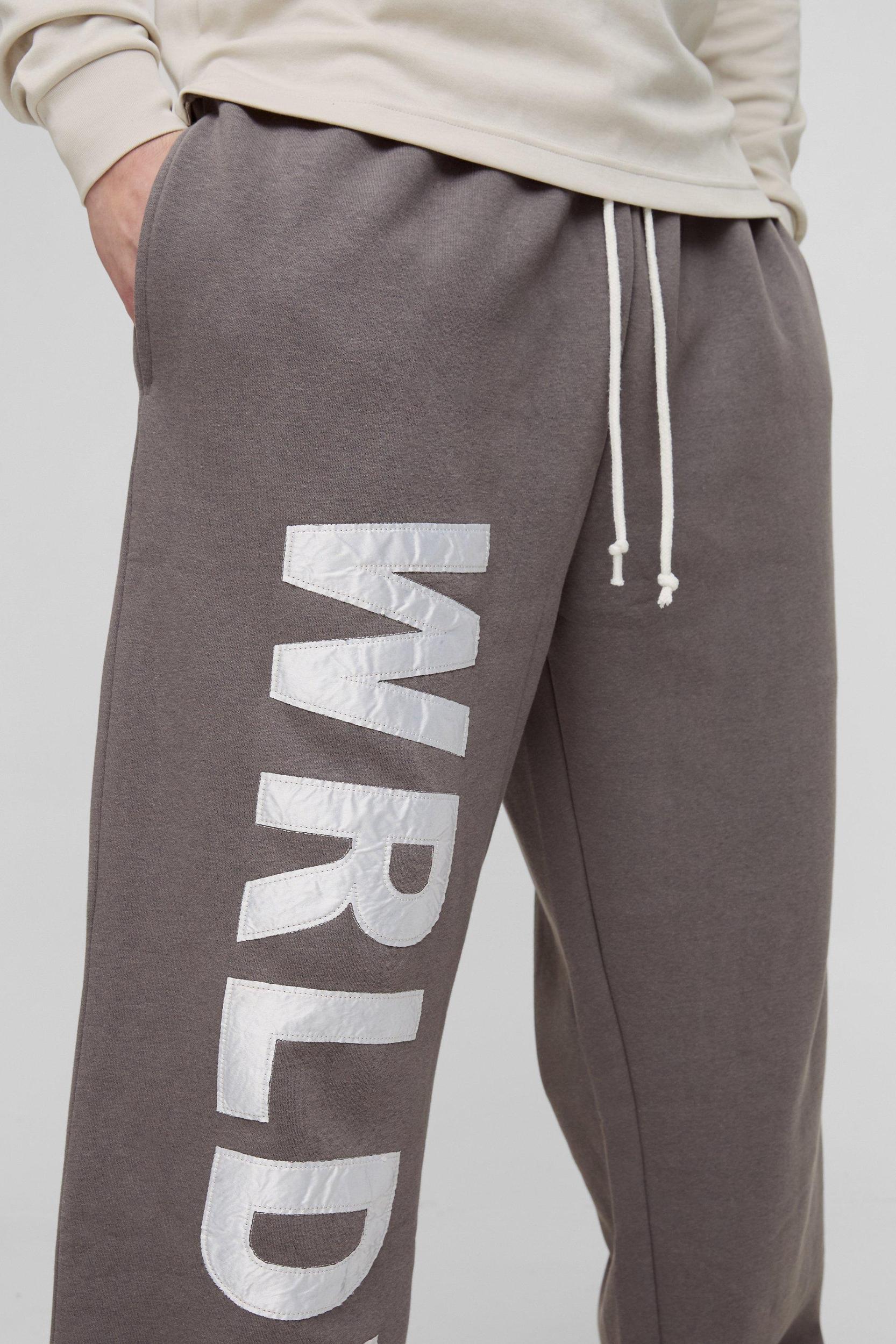 Tall Relaxed Satin Applique WRLDWD Sweatpants | boohooMAN USA Product Image