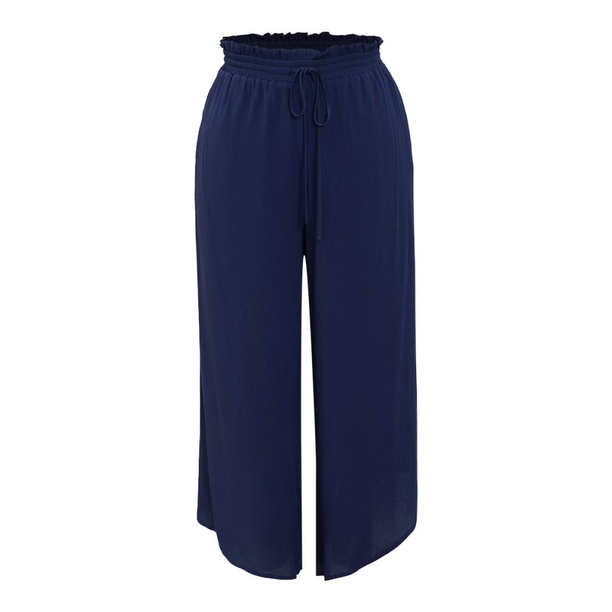 Plus Size Solid Paperbag Waist Asymmetrical Hem Wide Leg Pants Women Indigo Elegant High Rise Dailywear Pants BloomChic 12/L Product Image