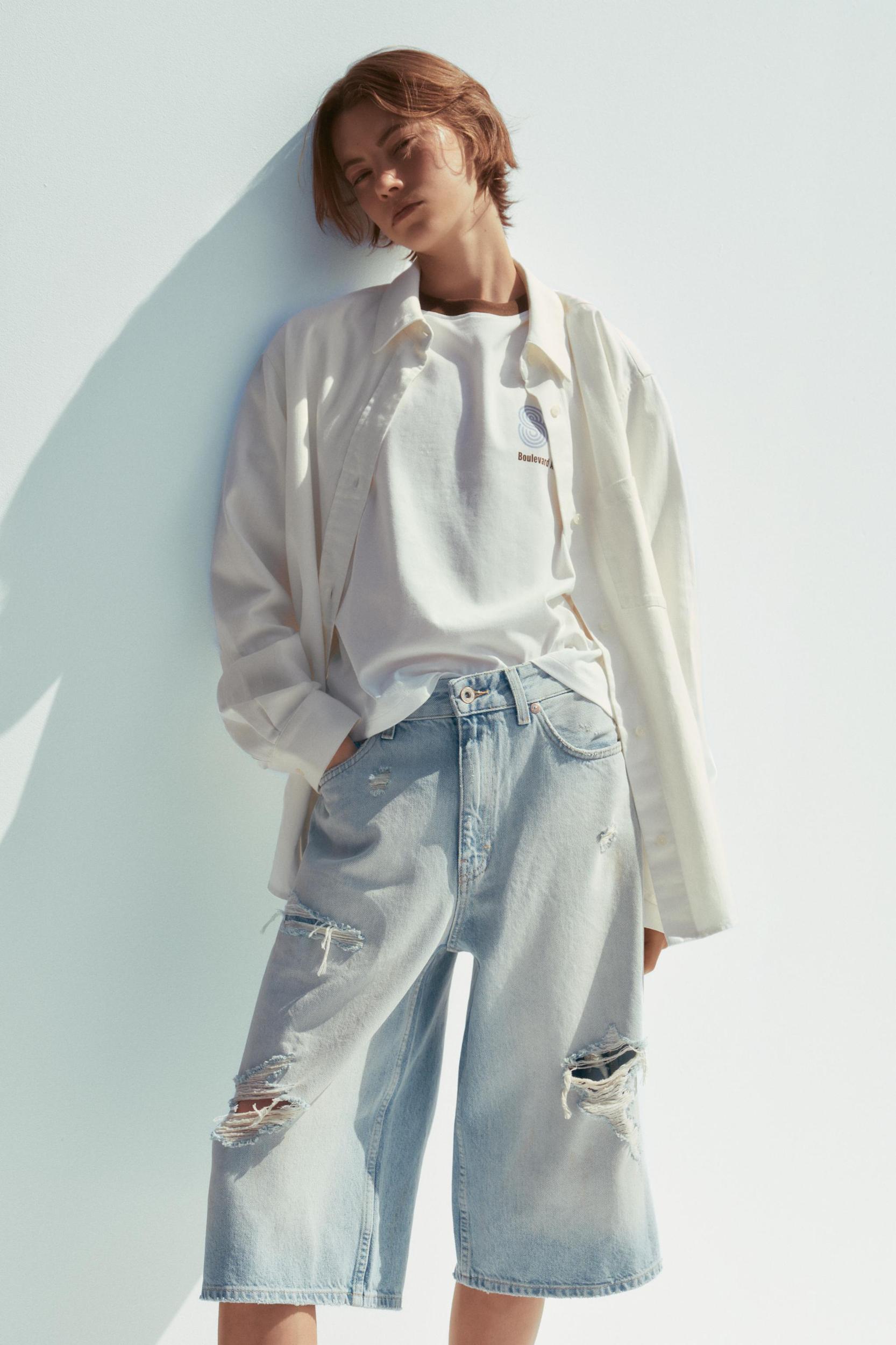 MID-RISE RIPPED DENIM BERMUDA JORTS Product Image