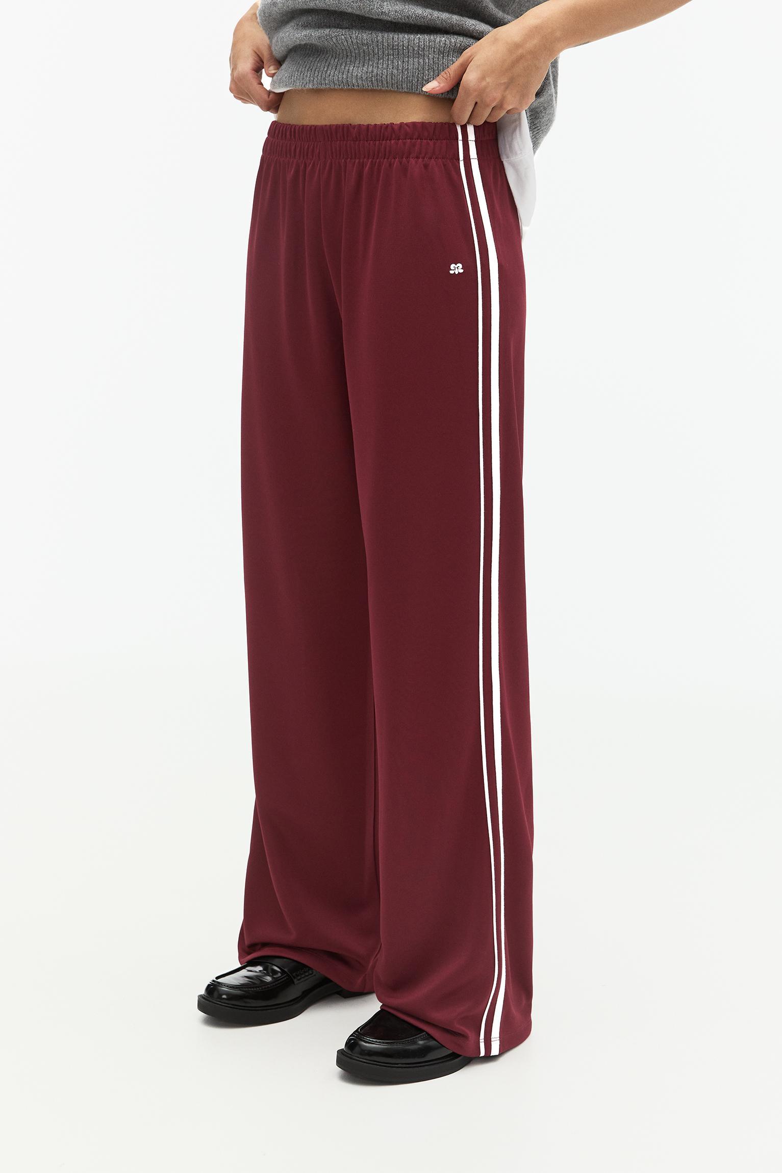 Tracksuit pants with side stripes Product Image