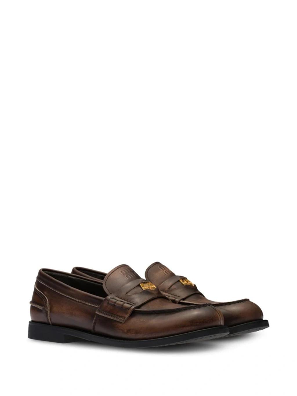 MIU MIU Leather Distressed Penny Loafers In Brown Product Image