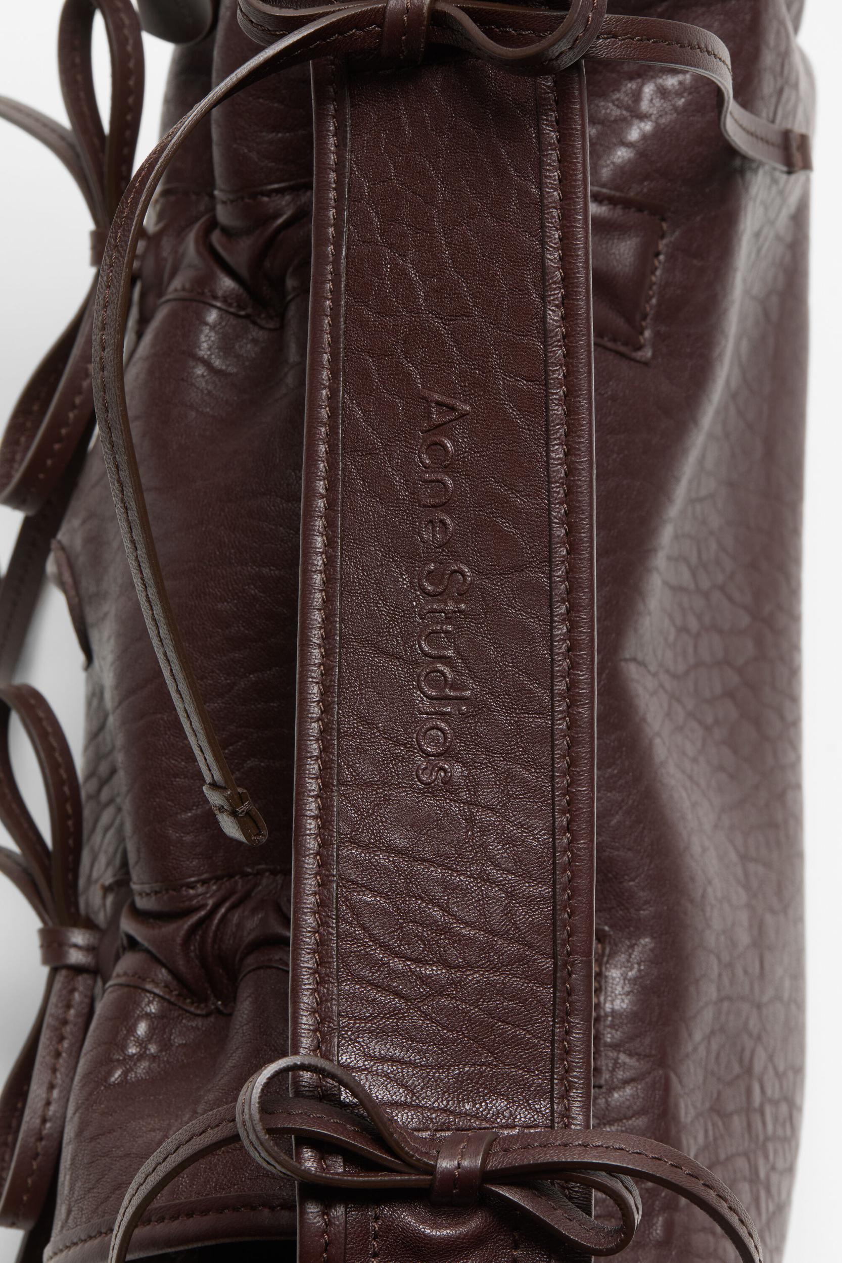Multipocket grained leather bag Product Image