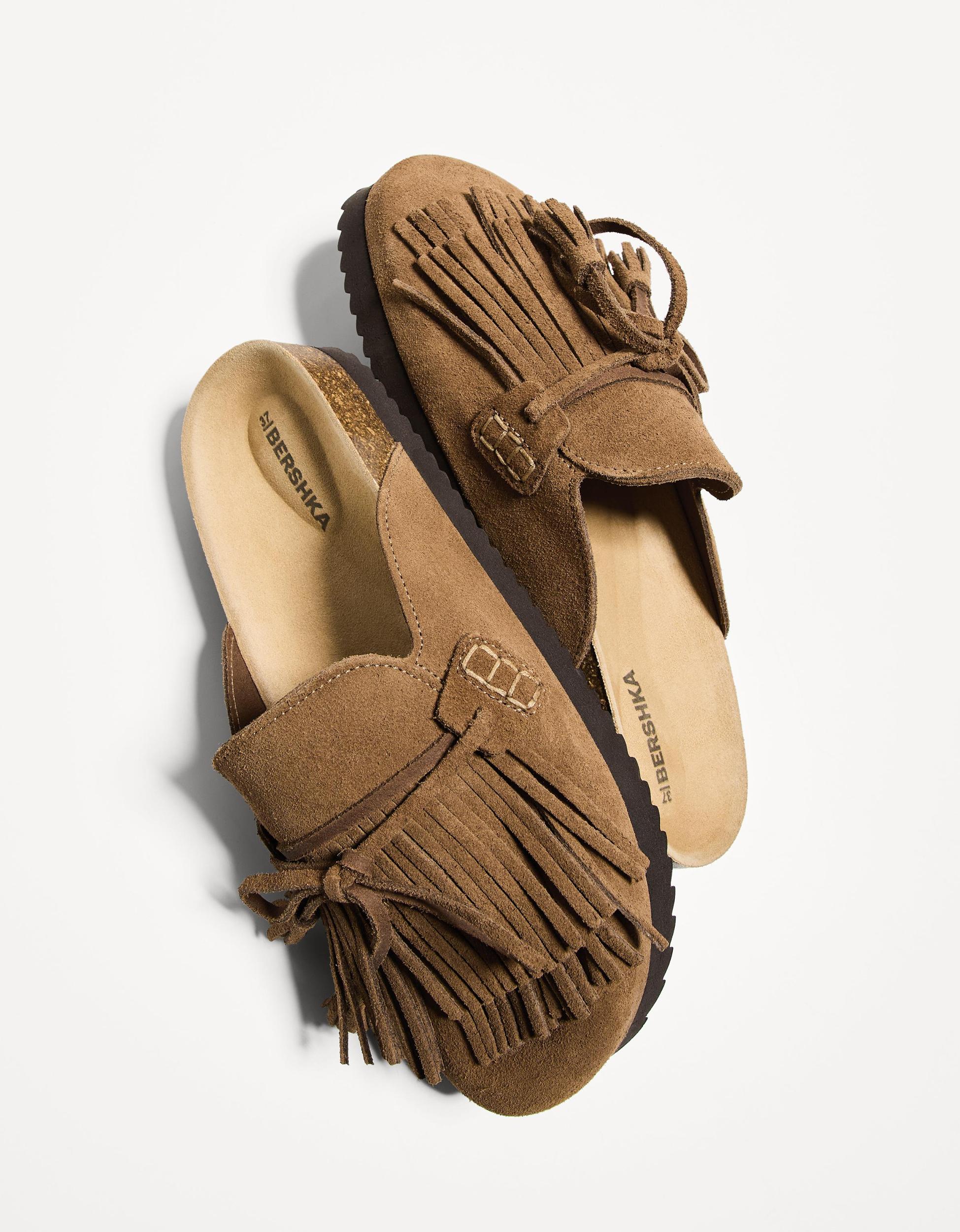 Flat LEATHER clogs with fringe detail Product Image