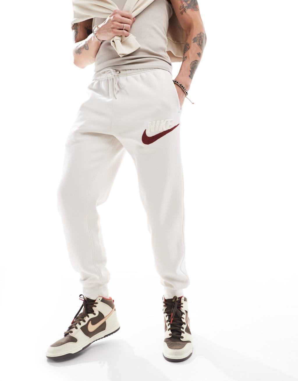 Nike Club Chenile Futura logo joggers in beige Product Image