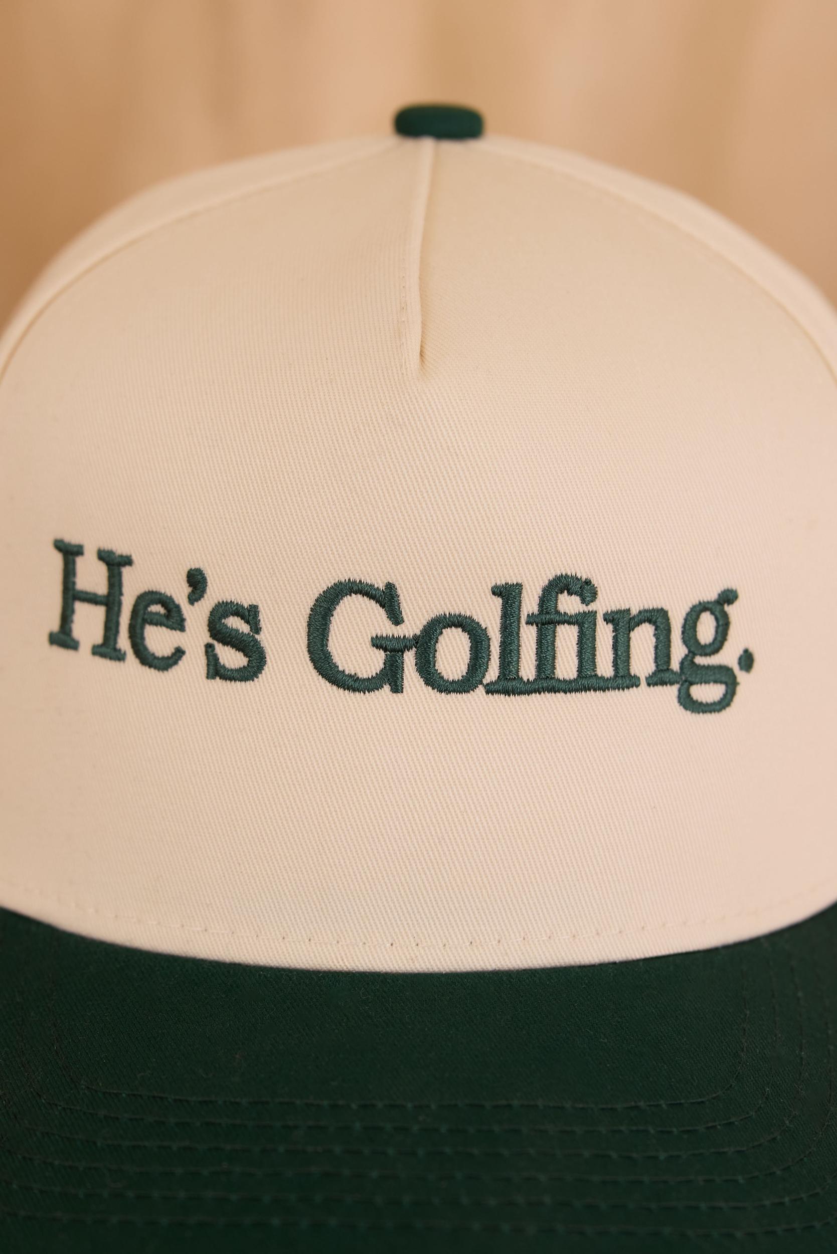 He's Golfing Trucker Hat Product Image