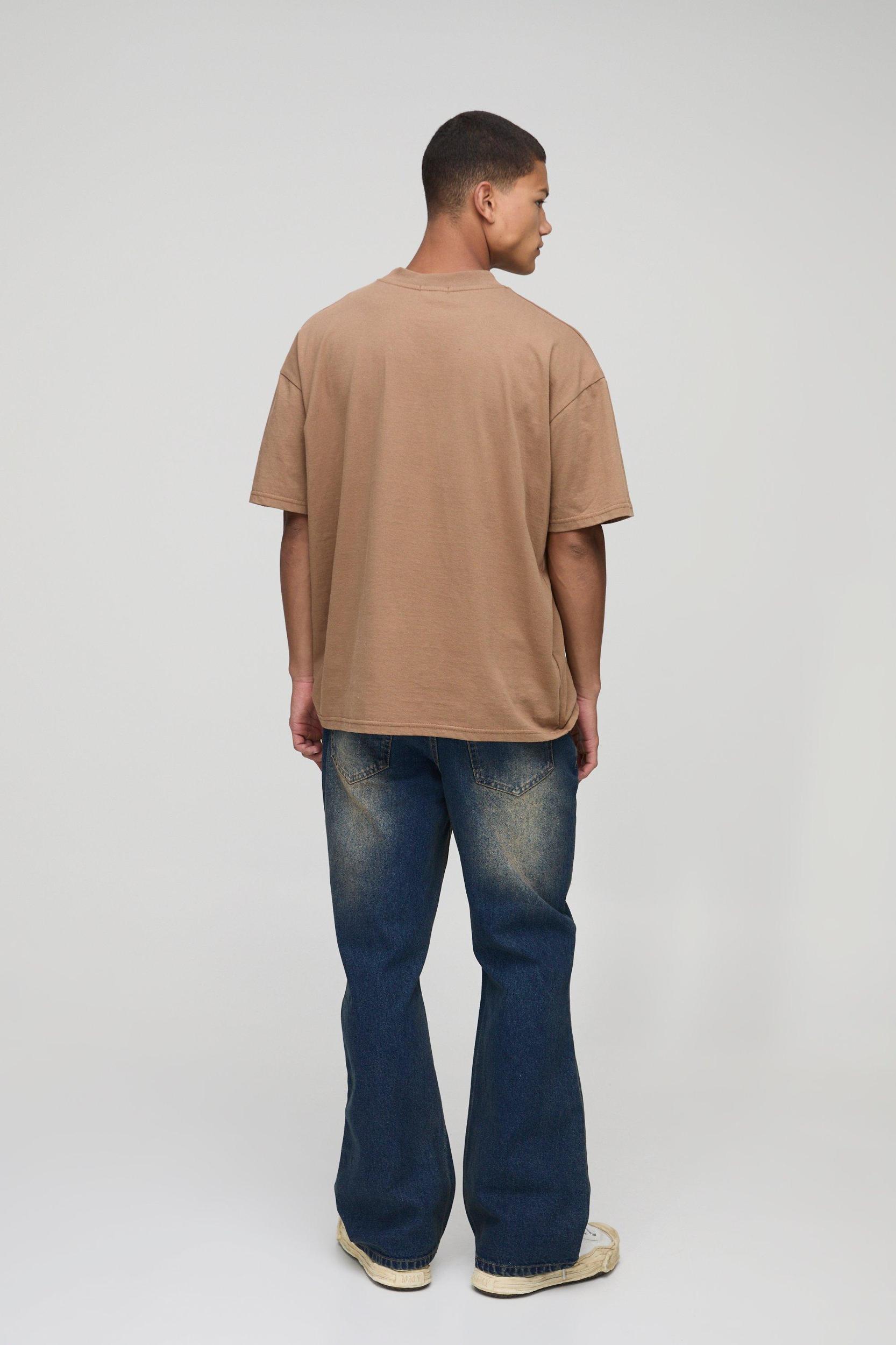 Relaxed Flared Washed Ripped Knee Jeans | boohooMAN USA Product Image