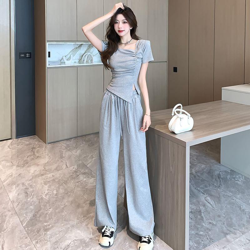 Set: Short-Sleeve Asymmetrical Neck Ruched Slit Slim Fit T-Shirt + Drawstring Waist Loose Fit Sweatpants Product Image