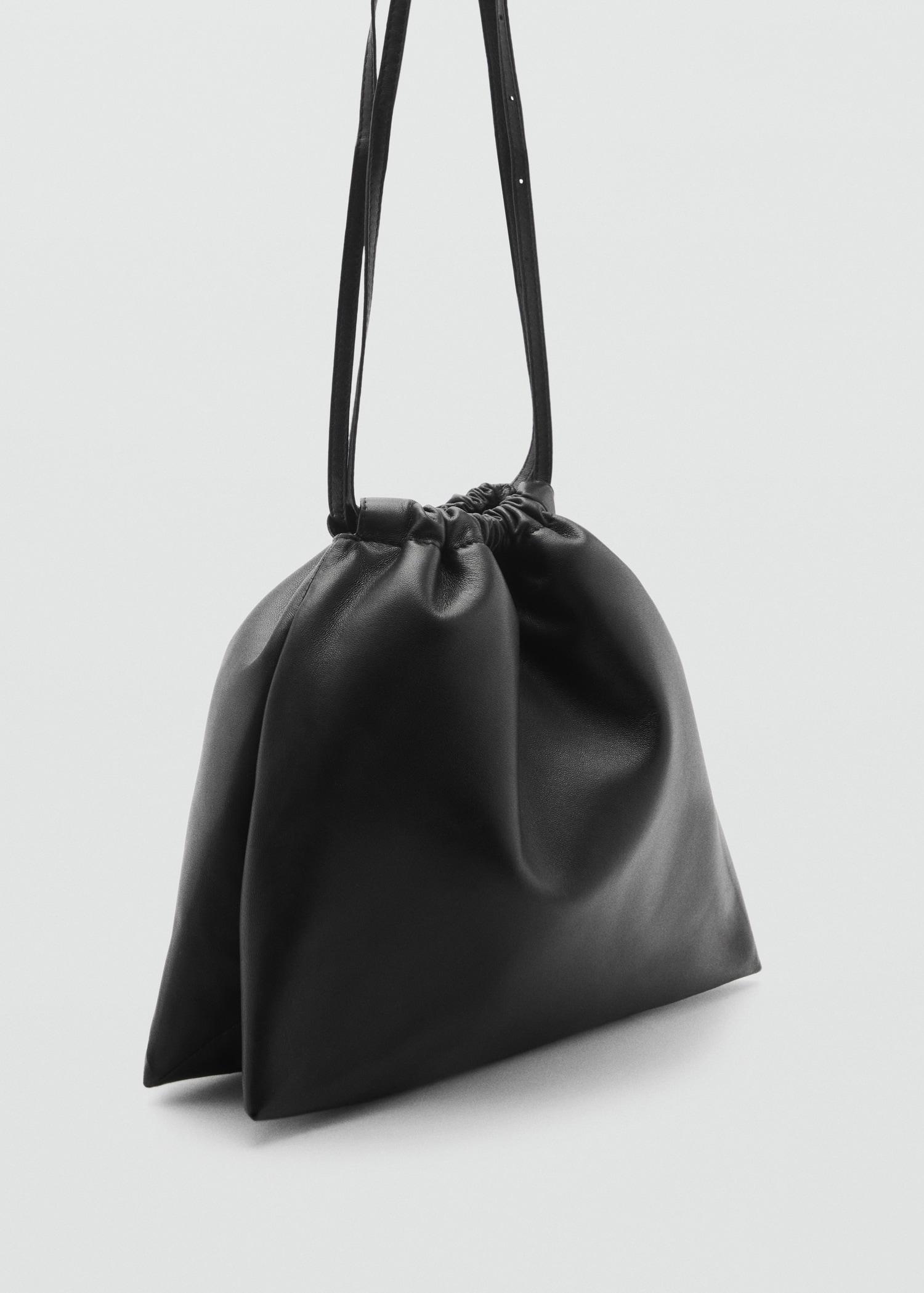 Sack-style leather bag - Women | MANGO USA Product Image