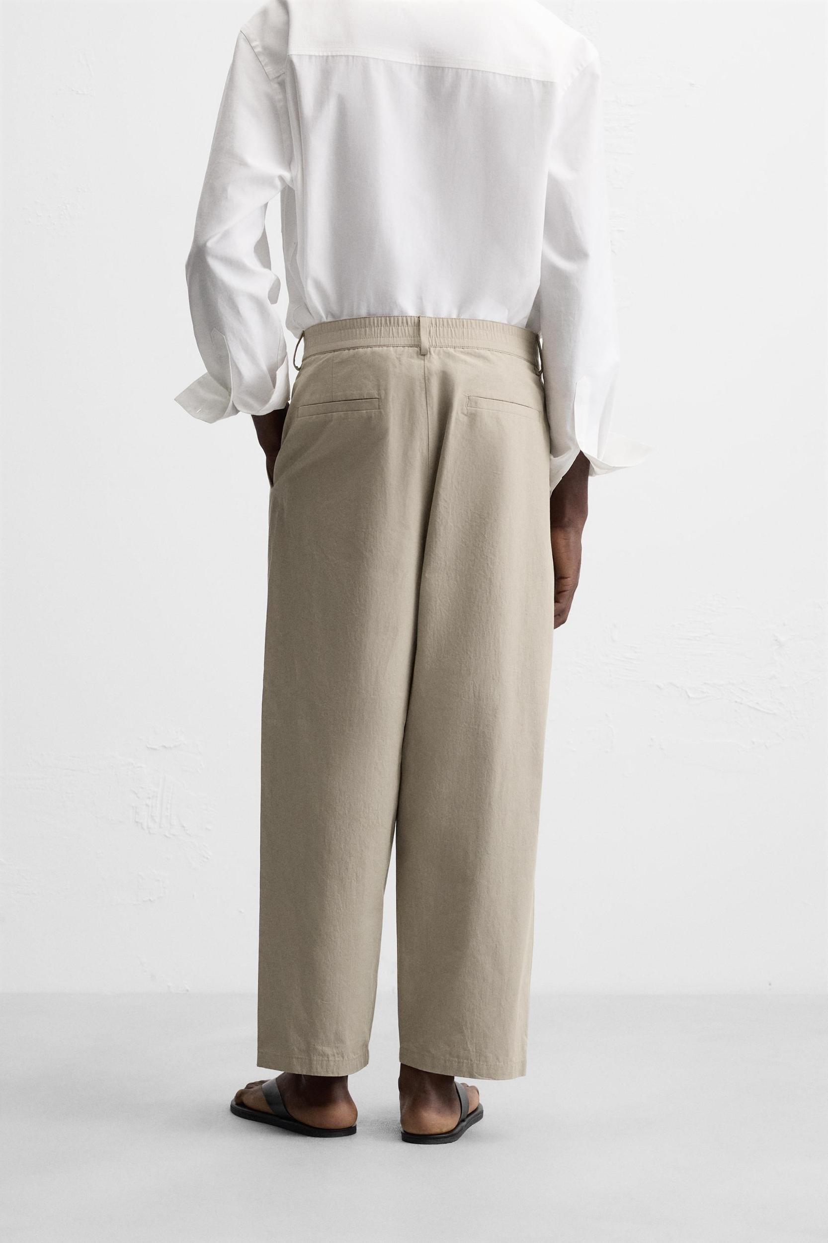 PLEATED CHINO PANTS Product Image
