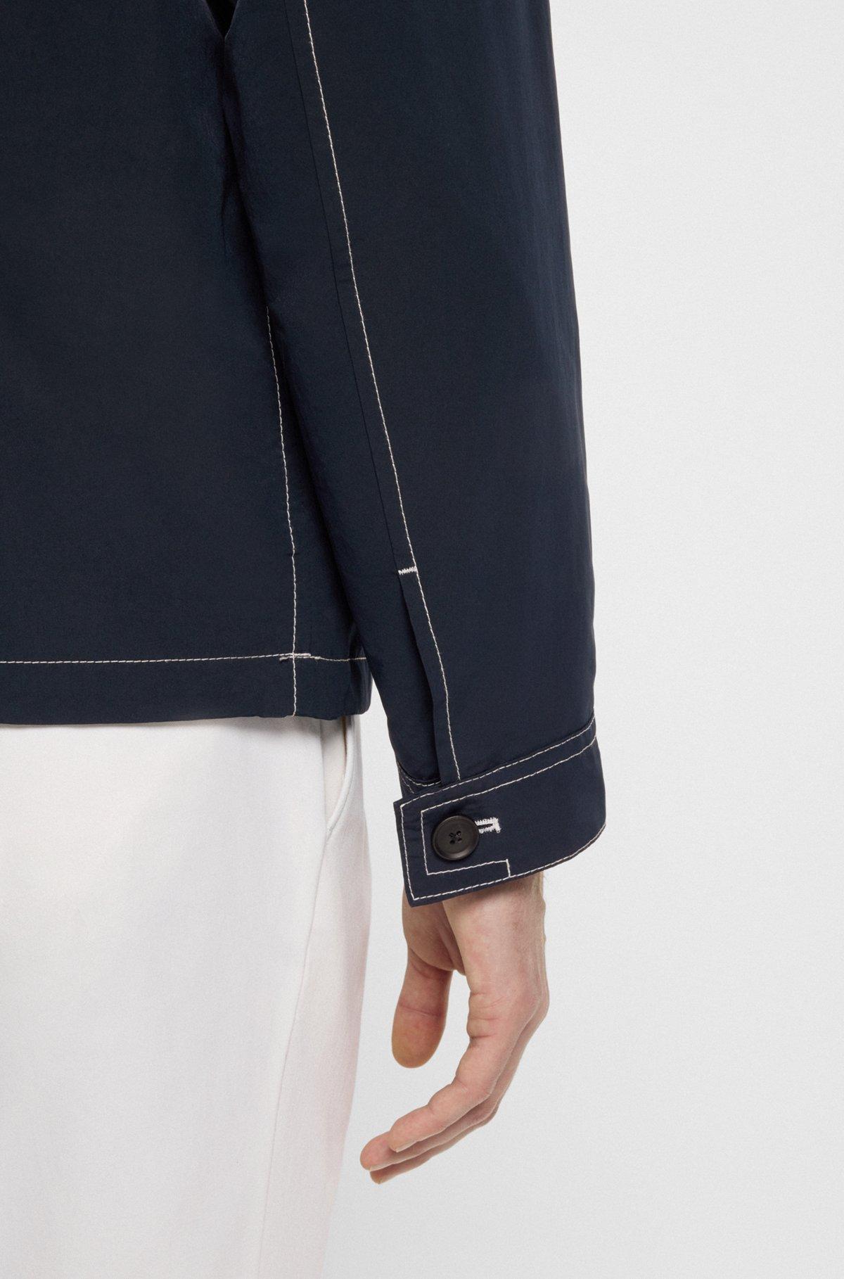 Packable hooded jacket in water-repellent mixed fabrics Product Image