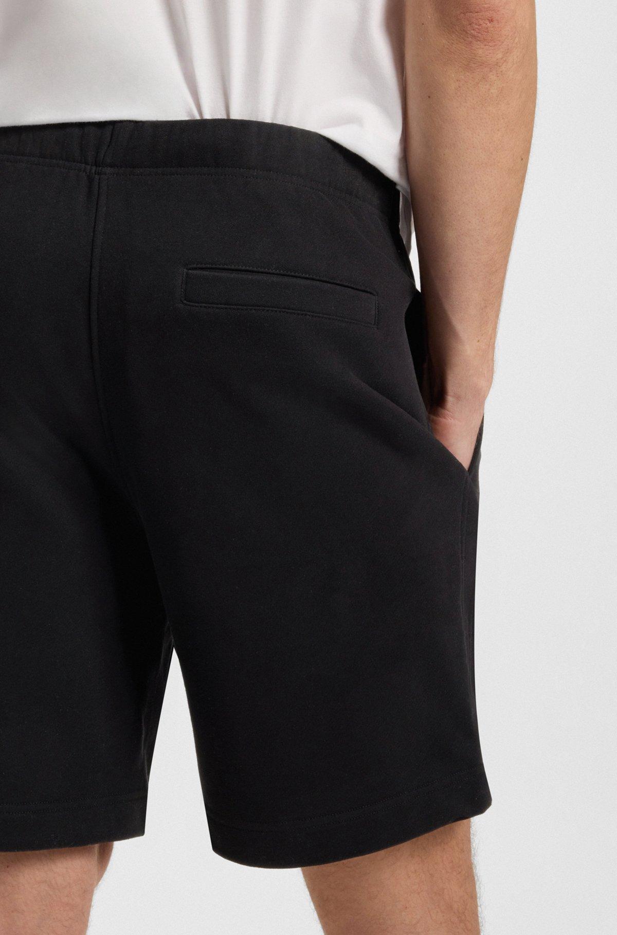 BOSS - BECKHAM x BOSS oversized-fit shorts in cotton terry - Black Product Image