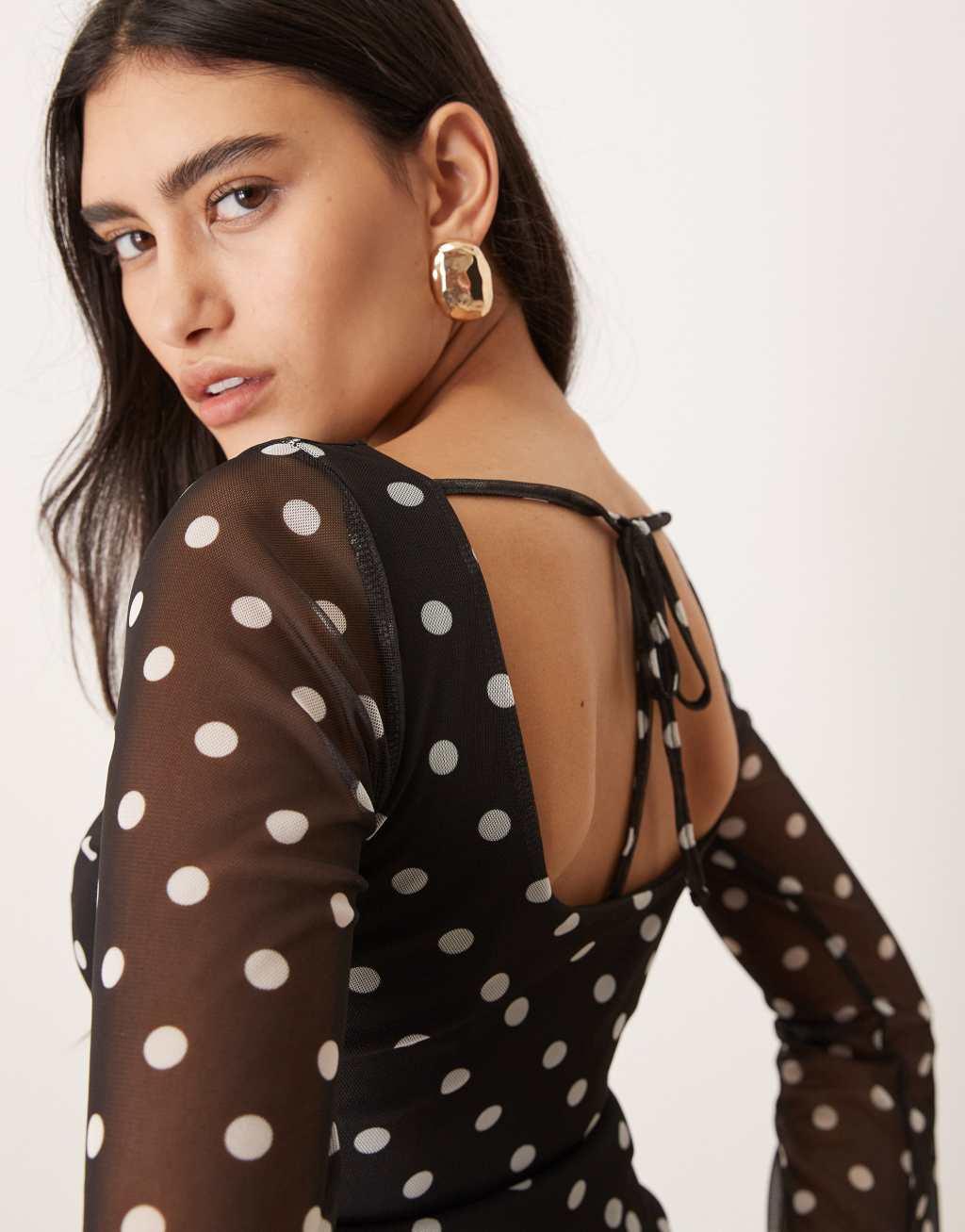 ASOS DESIGN polka dot printed mesh angel sleeve top with open tie back in black Product Image