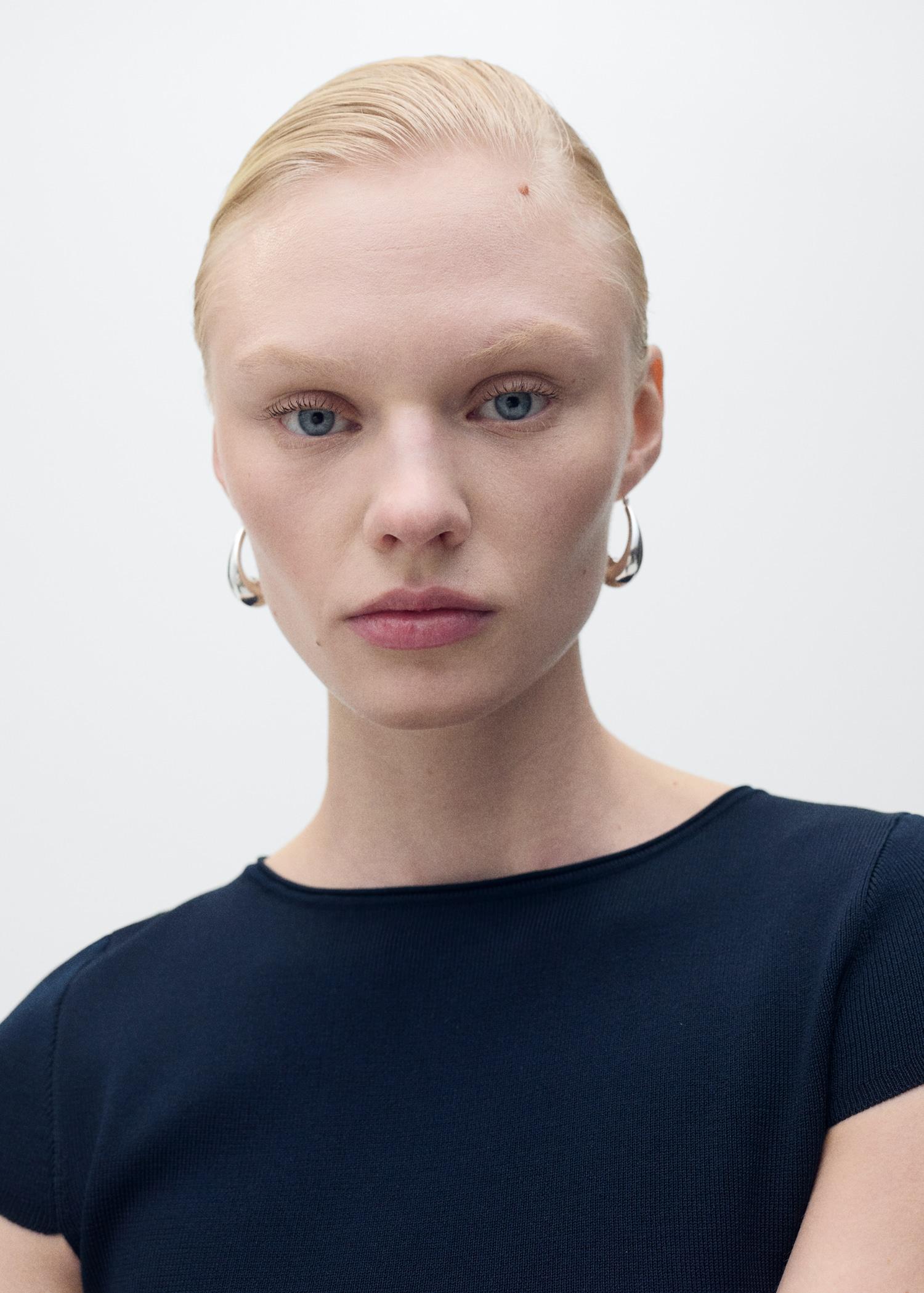 Knitted sweater with asymmetrical hem - Women | MANGO USA Product Image