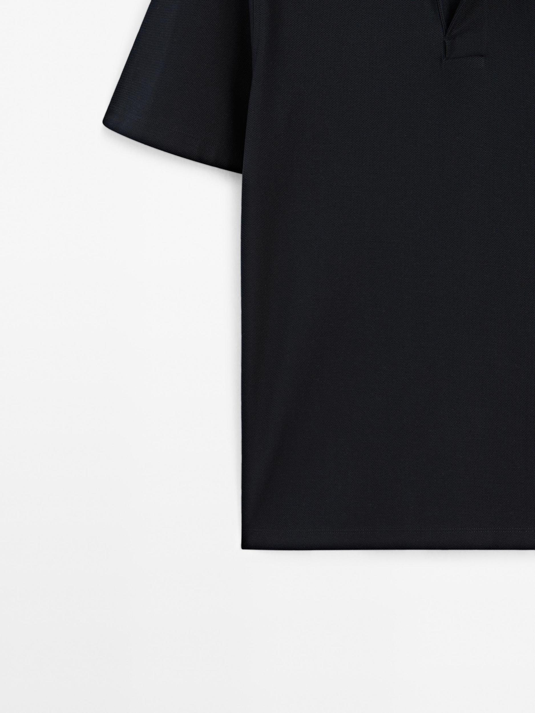 Textured polo shirt with hidden button Product Image