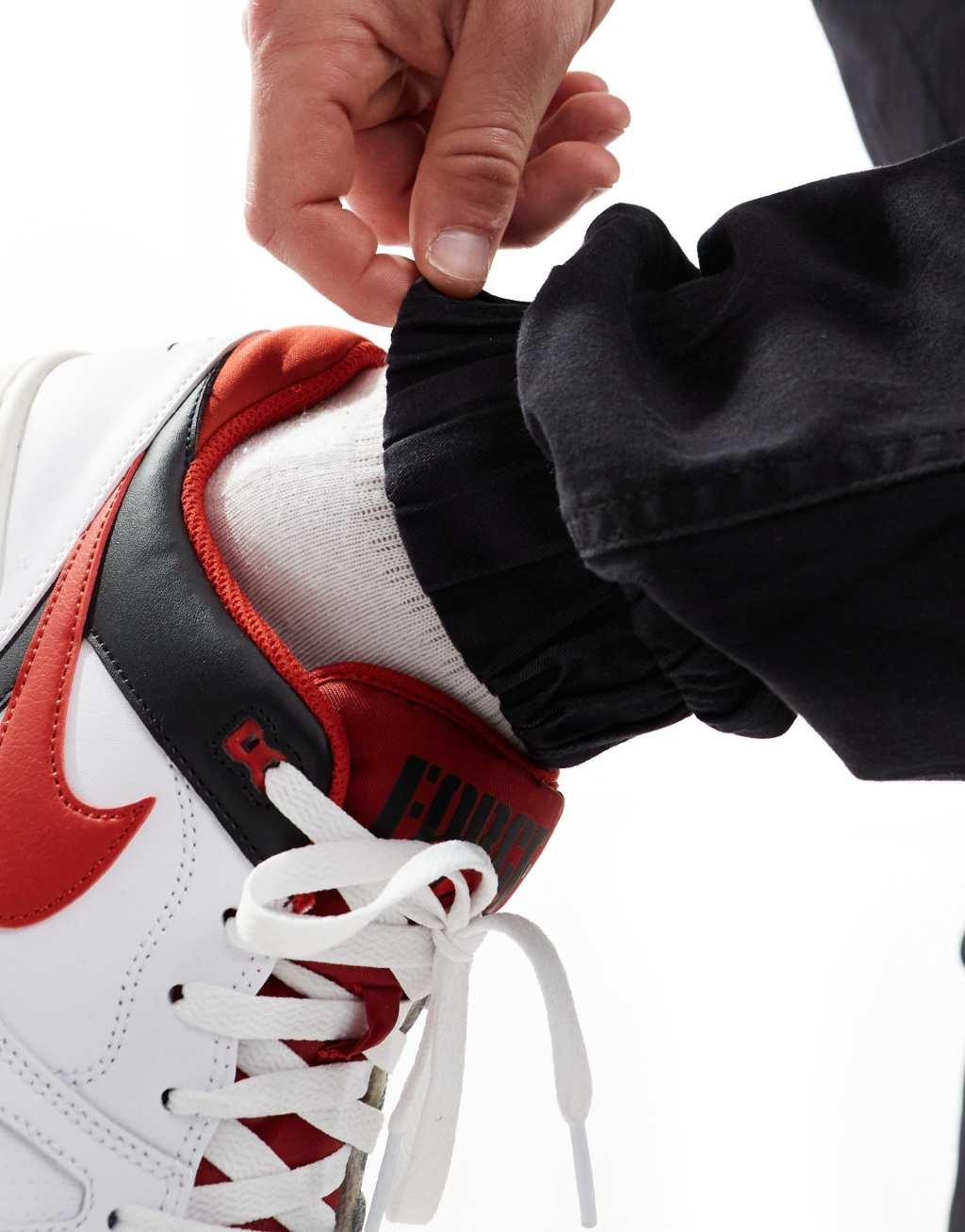 Only & Sons tapered fit cuffed cargo pants in black Product Image