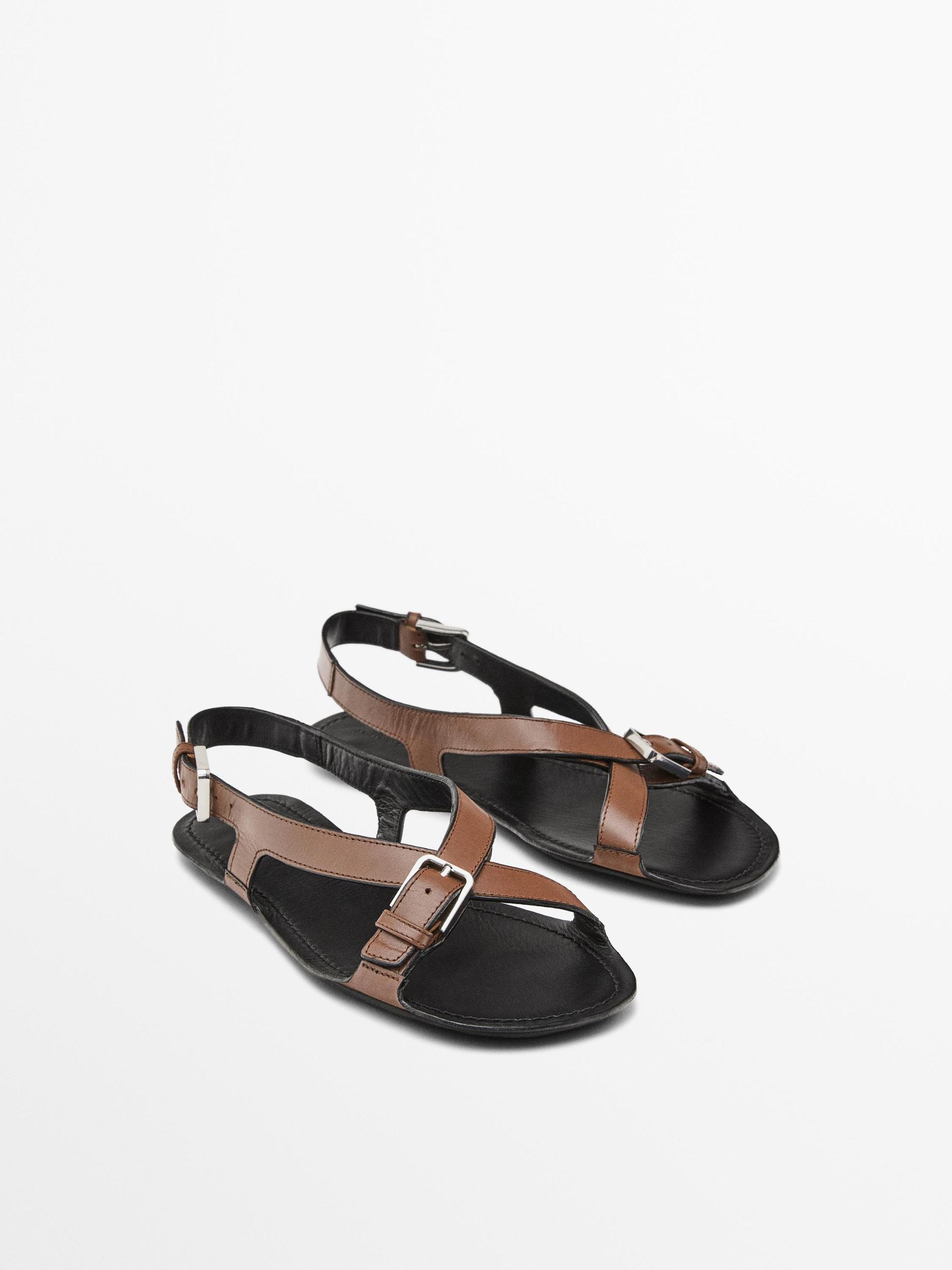 Flat leather sandals with buckles Product Image