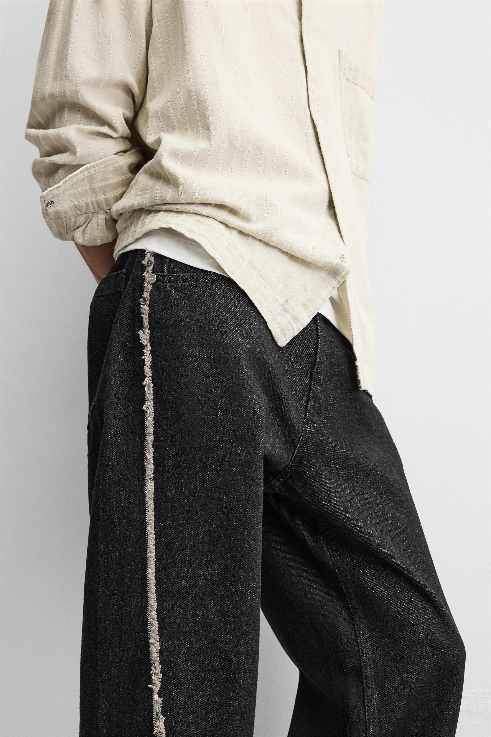 RELAXED FIT FRAYED SEAM JEANS Product Image