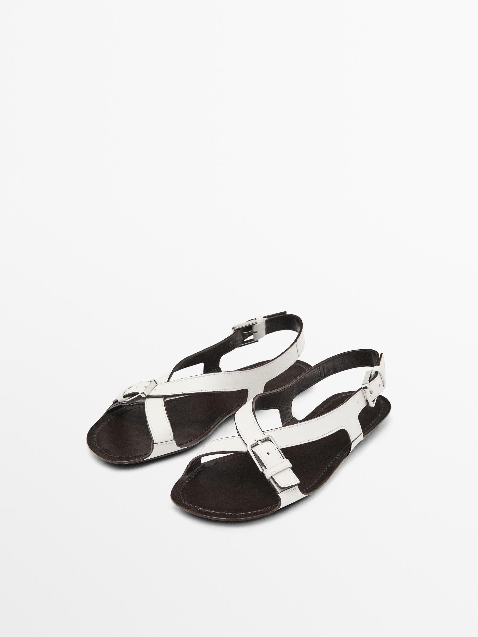 Flat leather sandals with buckles Product Image