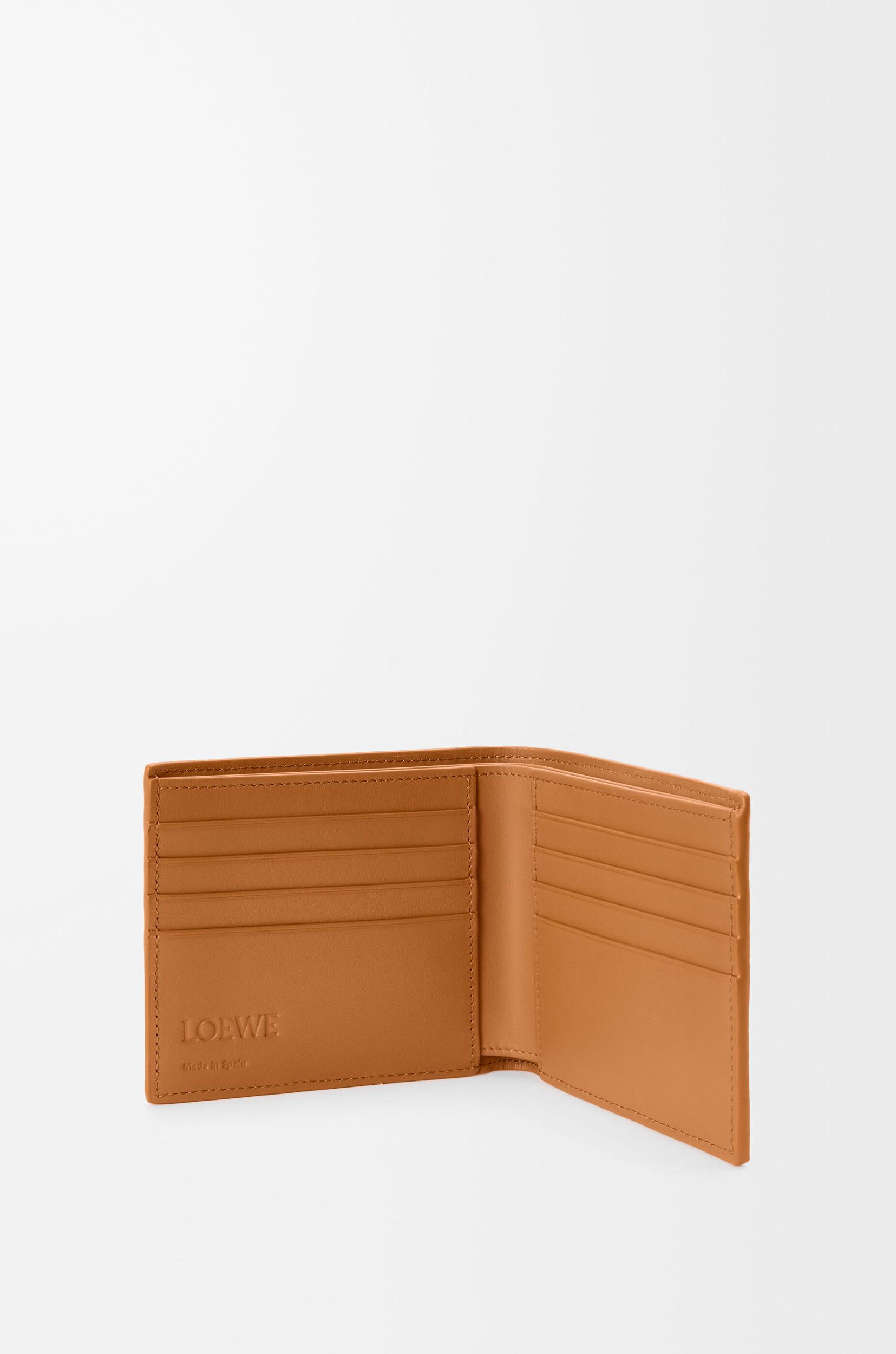 Puzzle bifold wallet in supple grained calfskin Product Image