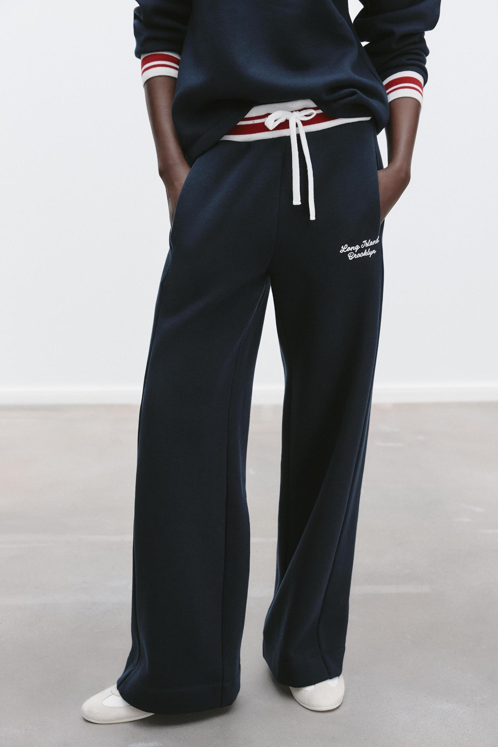 EMBROIDERED TEXT PANTS Product Image