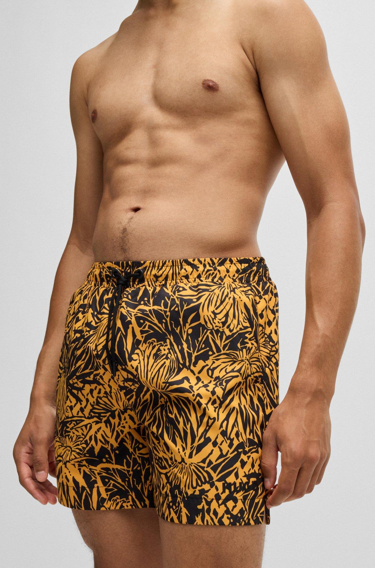 HUGO - Fully lined swim shorts with seasonal print - Black Product Image