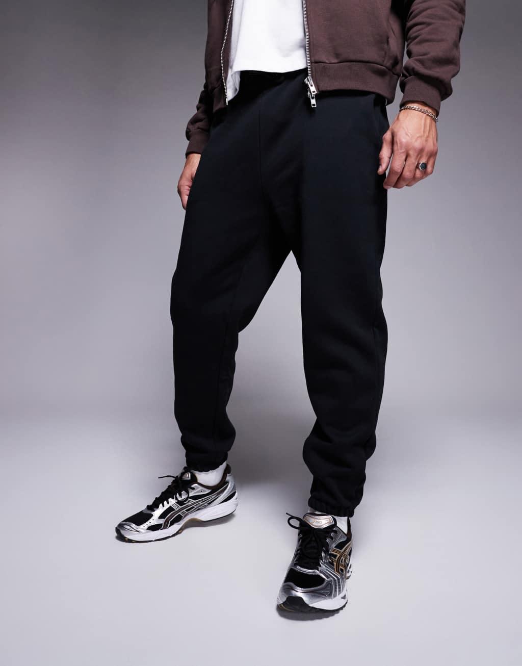 ASOS DESIGN premium heavyweight tapered sweatpants 400gsm in black Product Image