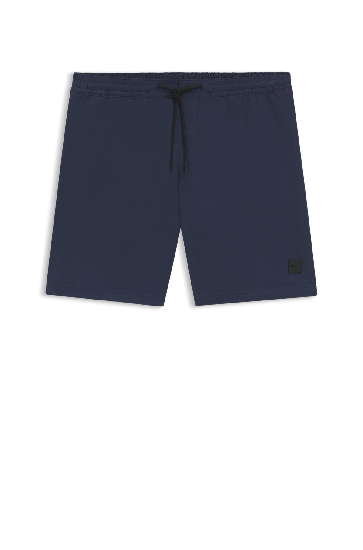 BOSS - Packable swim shorts with logo badge - Dark Blue Product Image