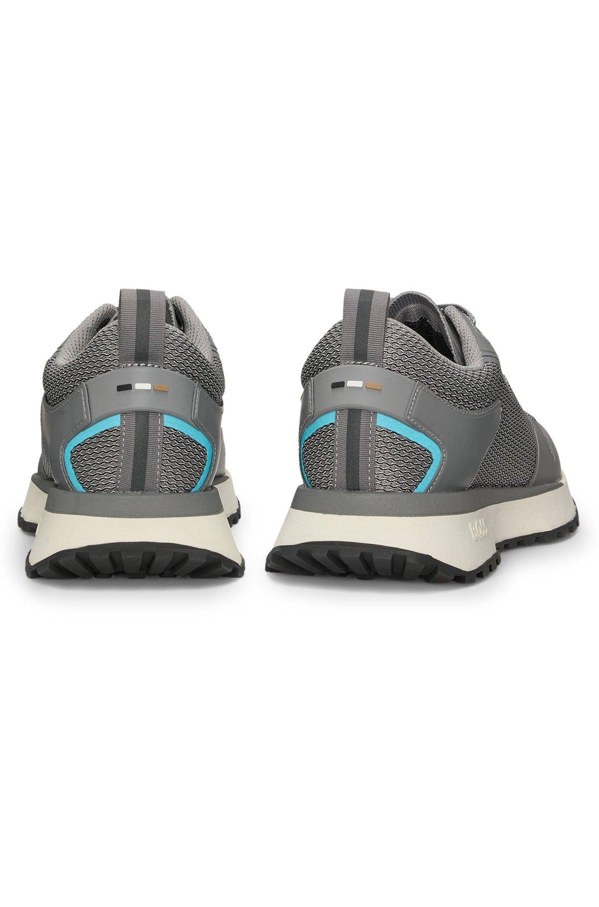 Mixed-material trainers with mesh details and branding Product Image