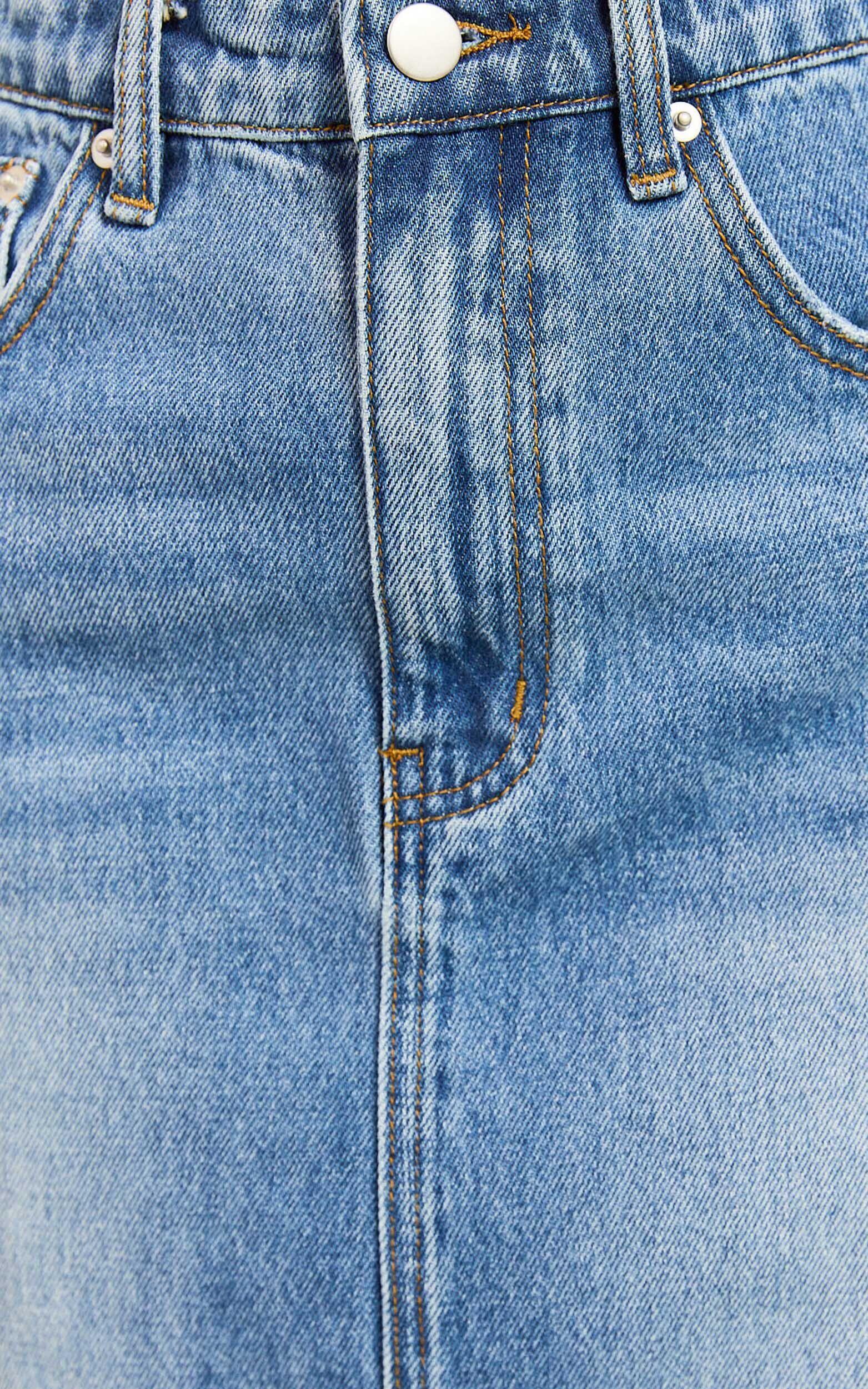 Adan Mini Skirt - Recycled Cotton Frayed Hem Denim Skirt in Mid Blue Wash Product Image