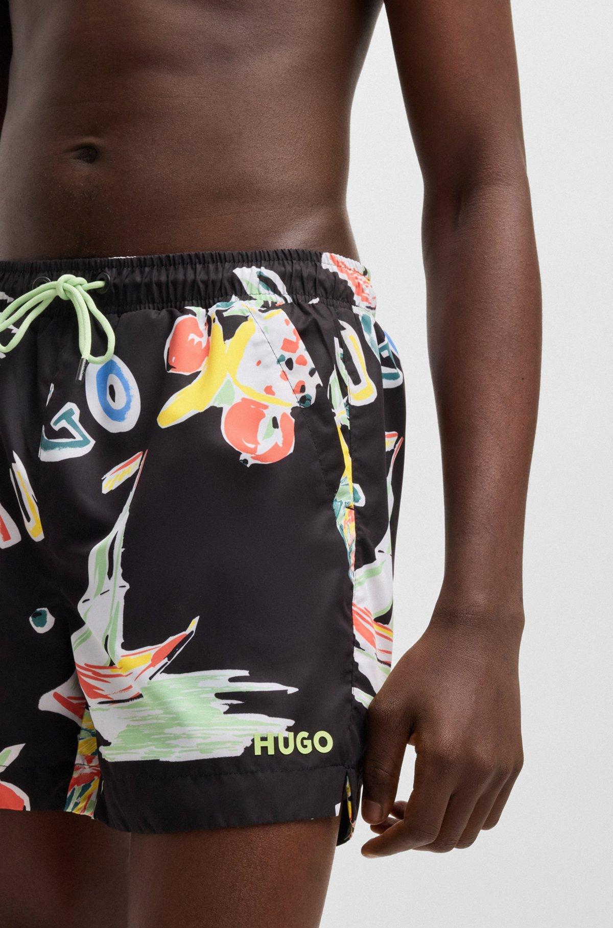 HUGO - Fully lined swim shorts with seasonal print - Black Product Image