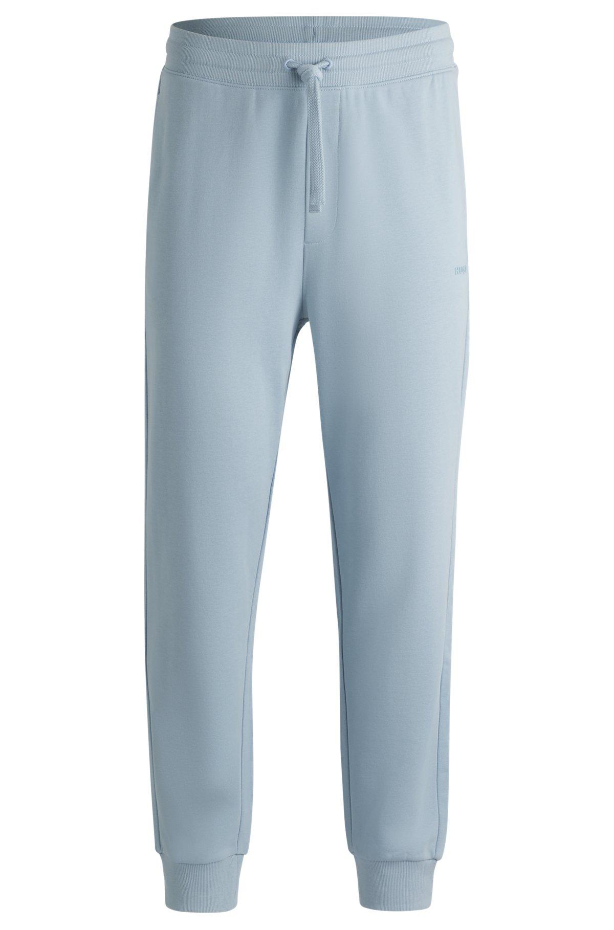 Cuffed tracksuit bottoms in cotton terry with logo print Product Image