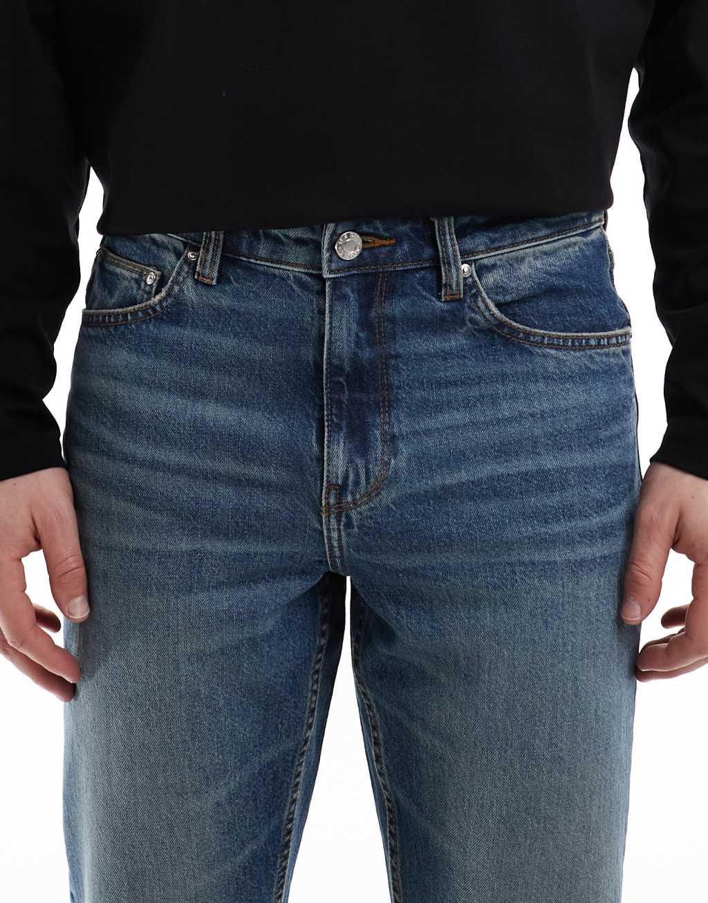 ASOS DESIGN stretch flare jeans in mid wash blue Product Image