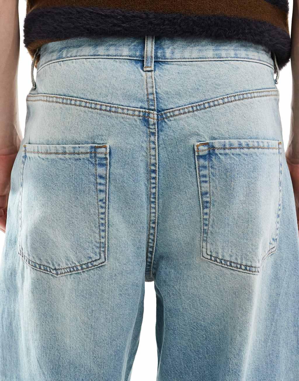 ASOS DESIGN baggy fit jeans in light wash blue Product Image