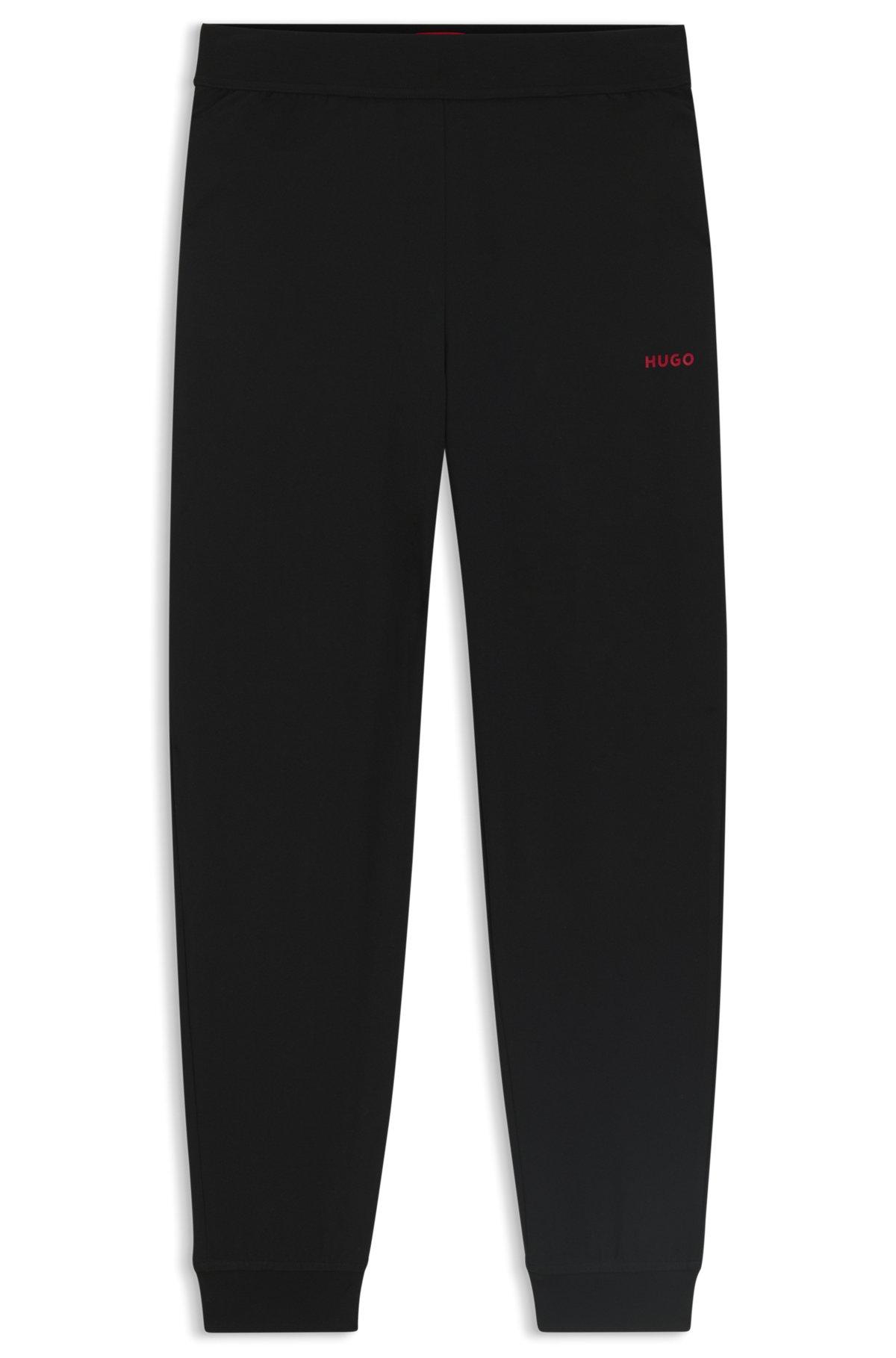 Relaxed-fit tracksuit bottoms with printed logo Product Image