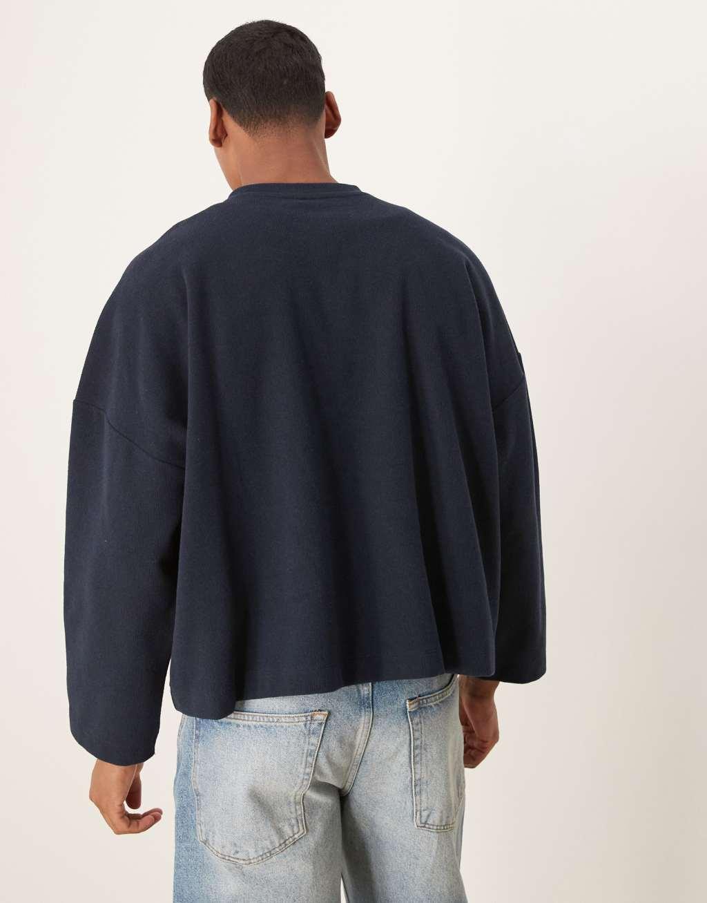 ASOS DESIGN super oversized cropped lightweight sweater with henley neck and print in navy Product Image