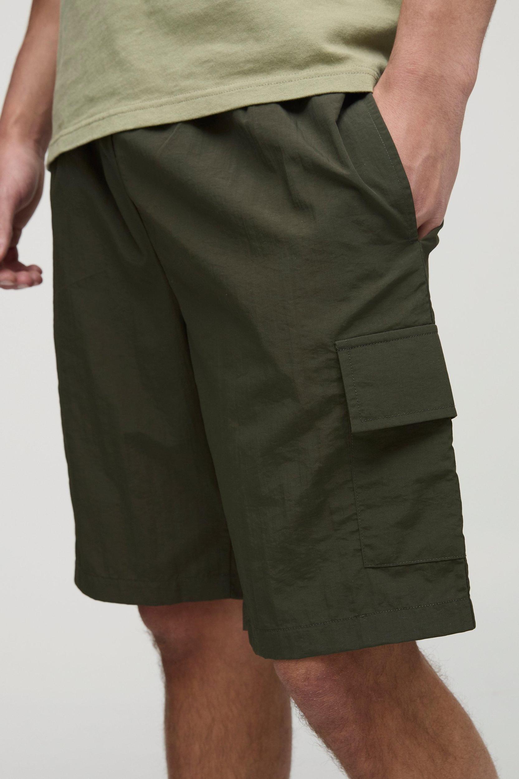Elasticated Waist Relaxed Mid Length Crinkle Nylon Cargo Shorts | boohooMAN USA Product Image