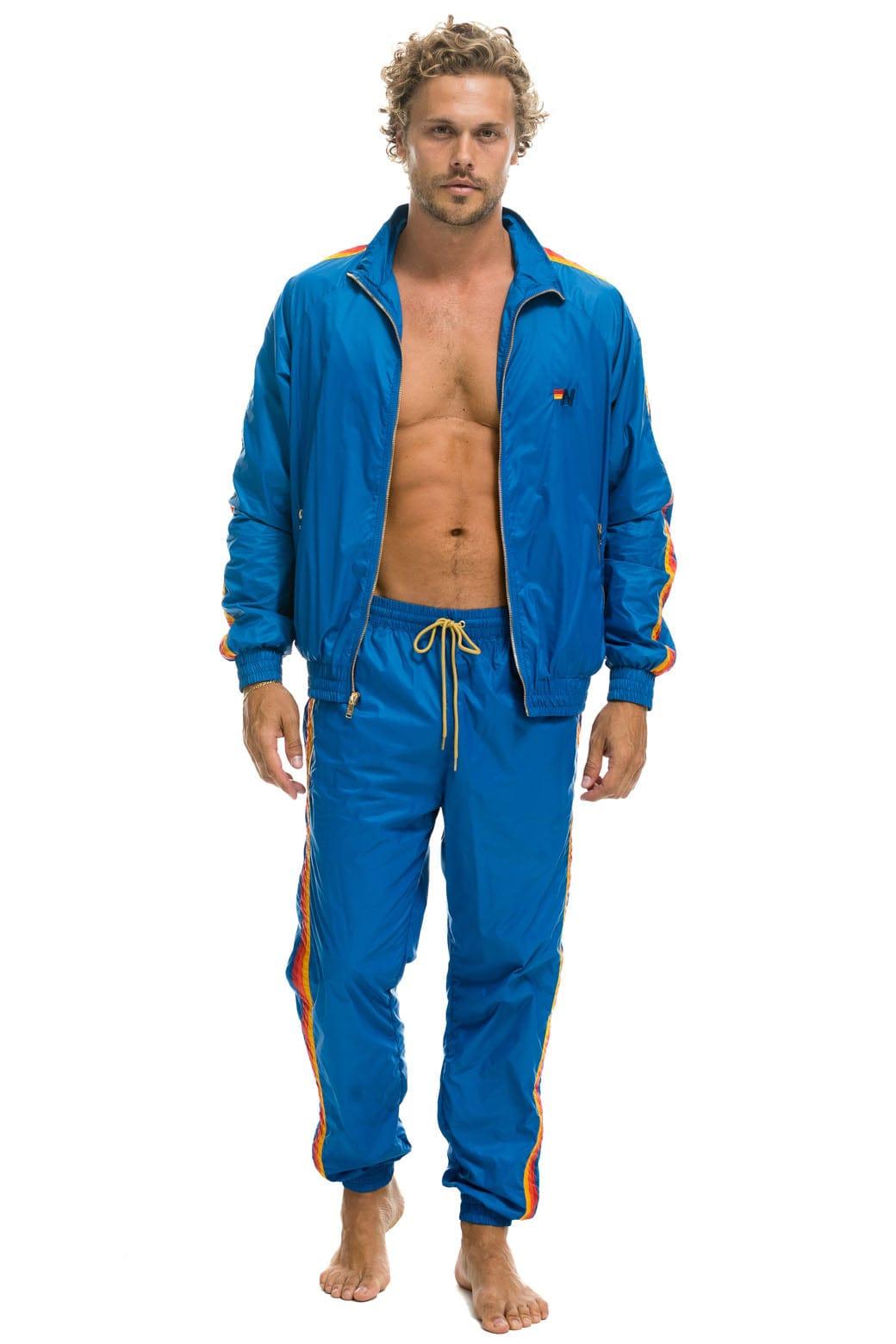 MEN'S 4 STRIPE WINDBREAKER -  SNORKEL BLUE Male Product Image