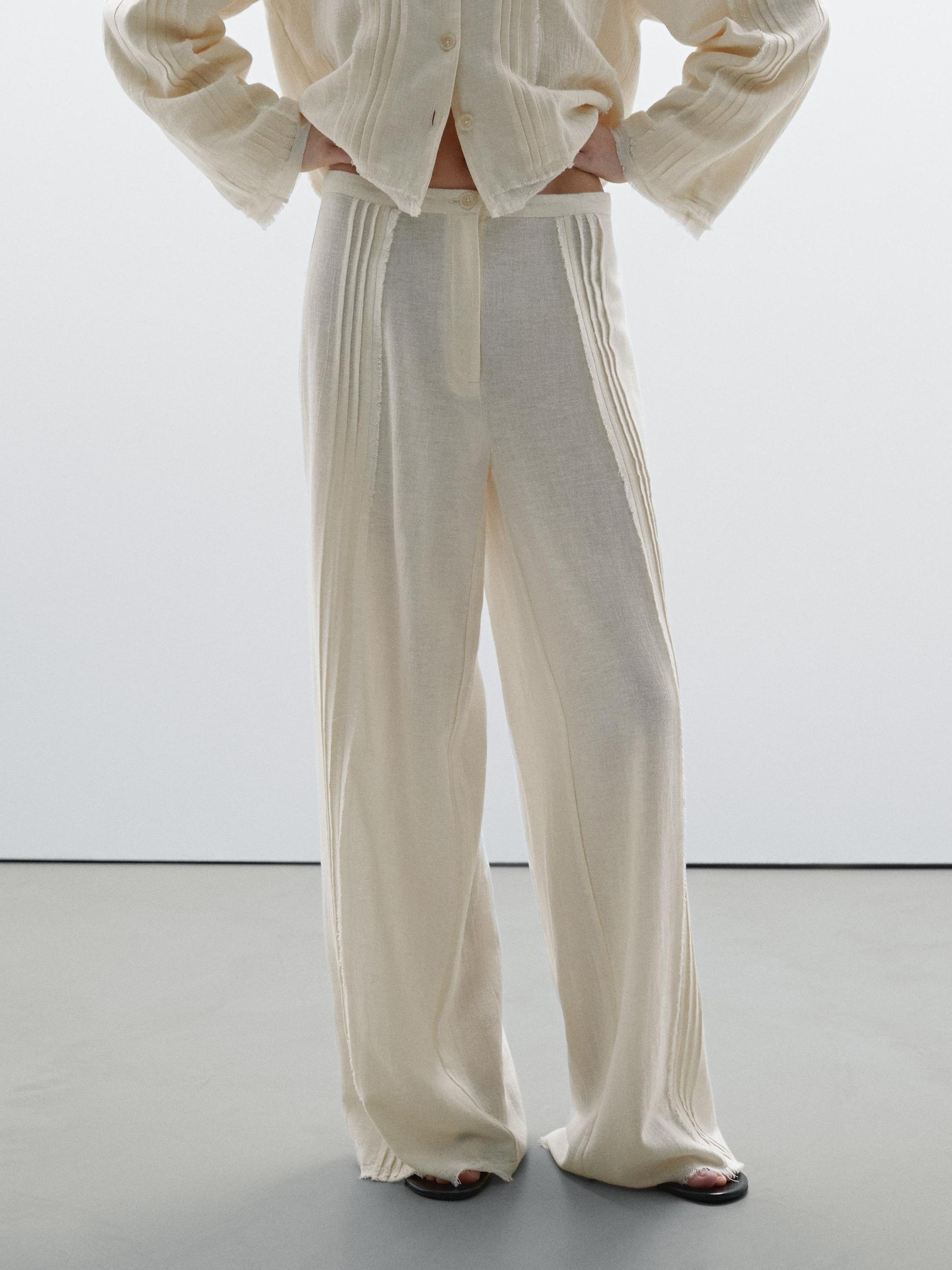 Cotton blend trousers with embroidered details Product Image