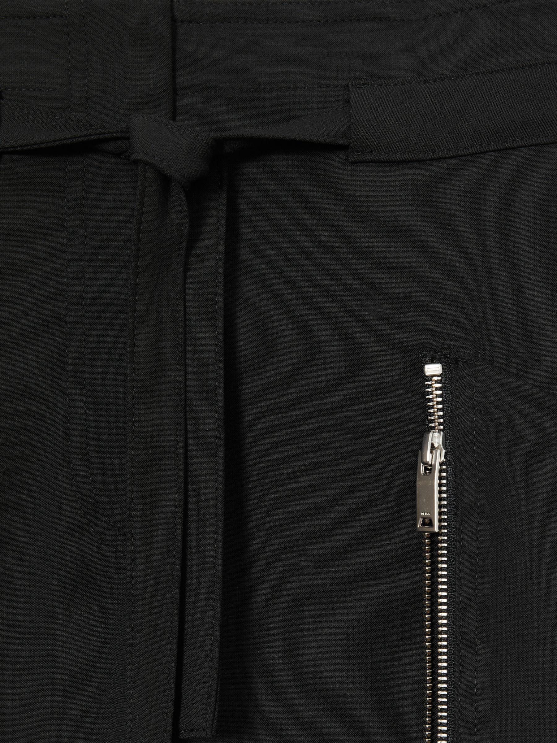 Atelier Zipped Crepe Trousers in Black Product Image