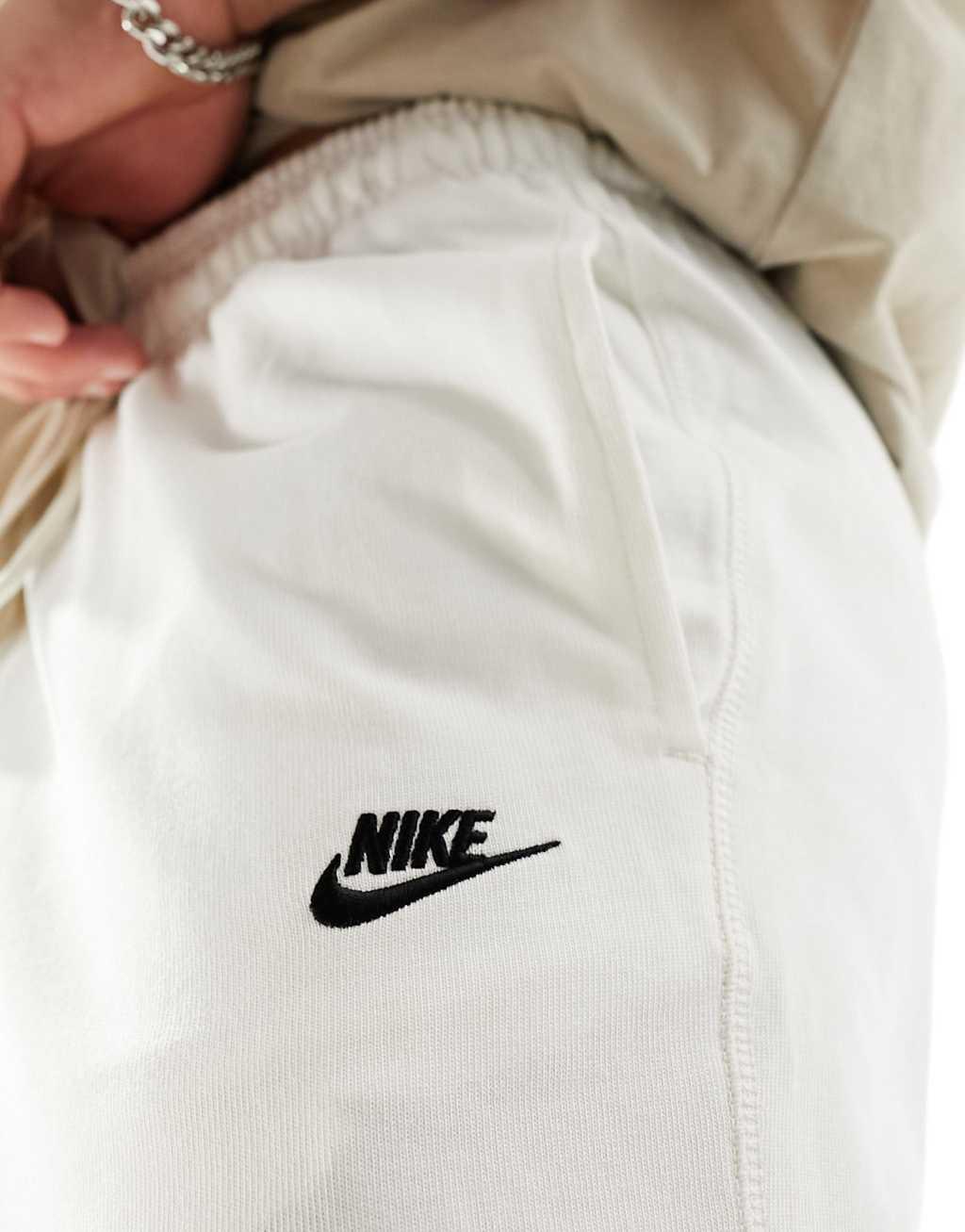 Nike Club Knit sweatpants in off white  Product Image