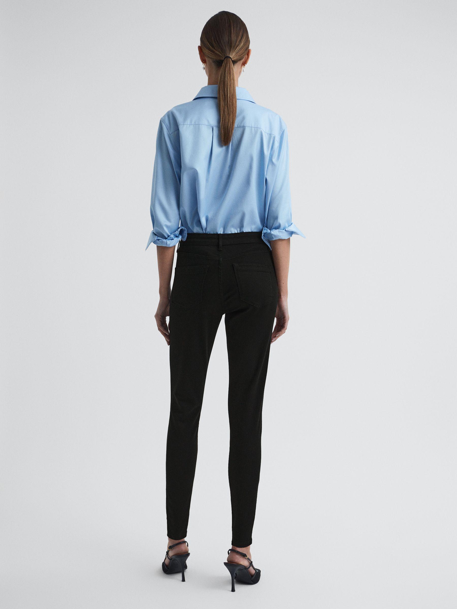 Mid Rise Skinny Jeans in Black Product Image