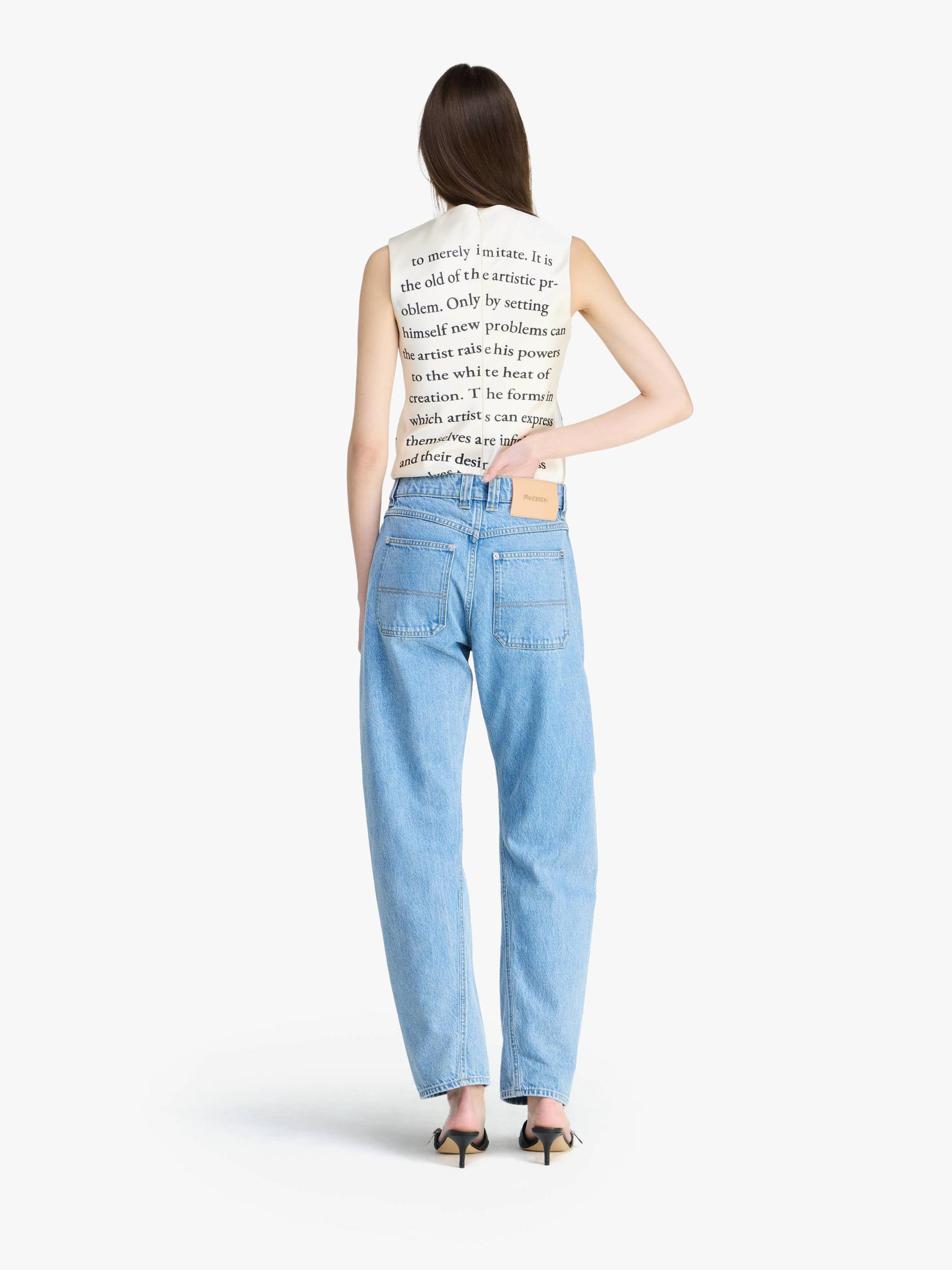 TWISTED SLIM LEG DENIM JEANS Product Image