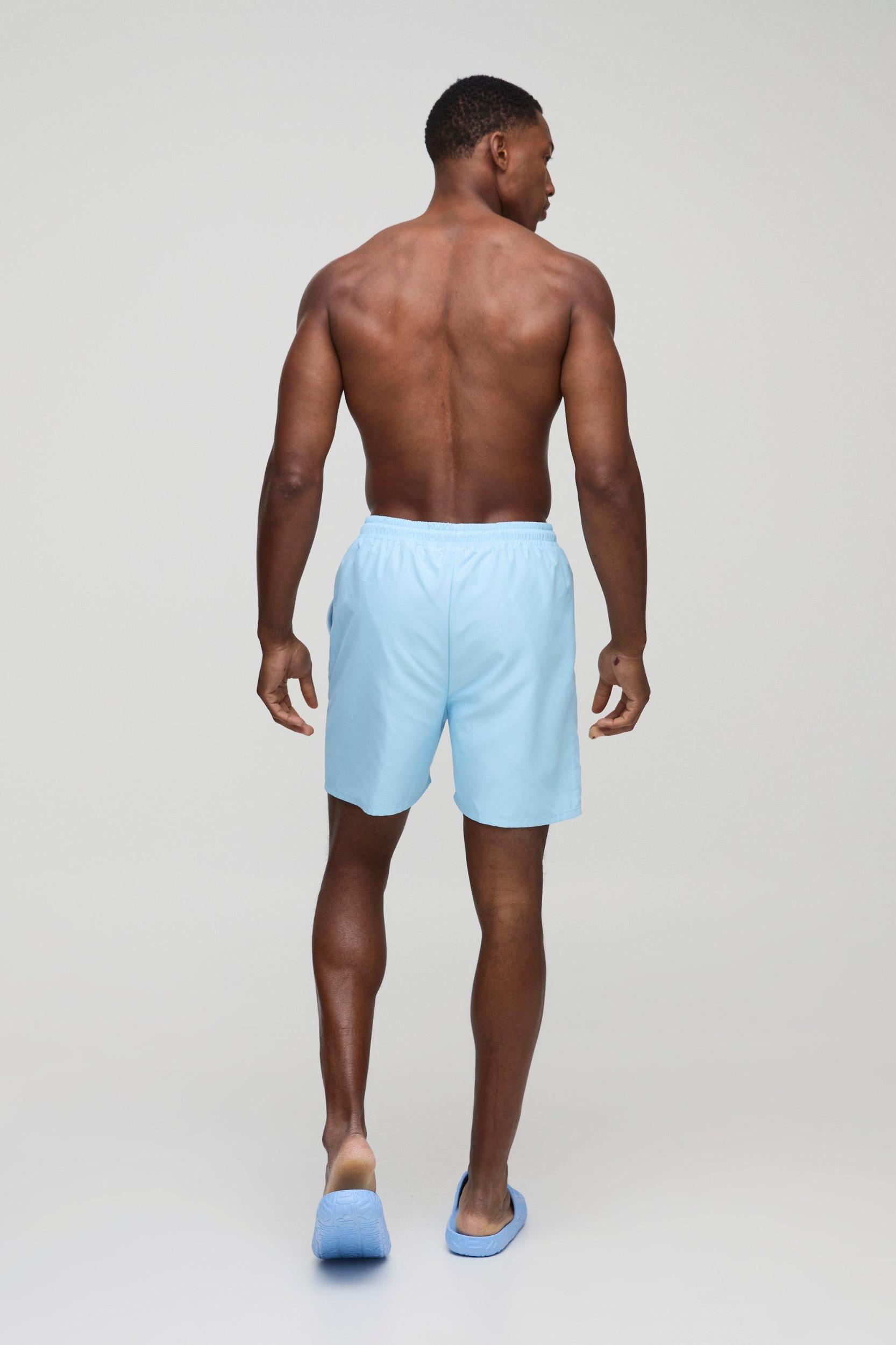 Branded Mid Length Swim Trunks in Light Blue | boohooMAN USA Product Image