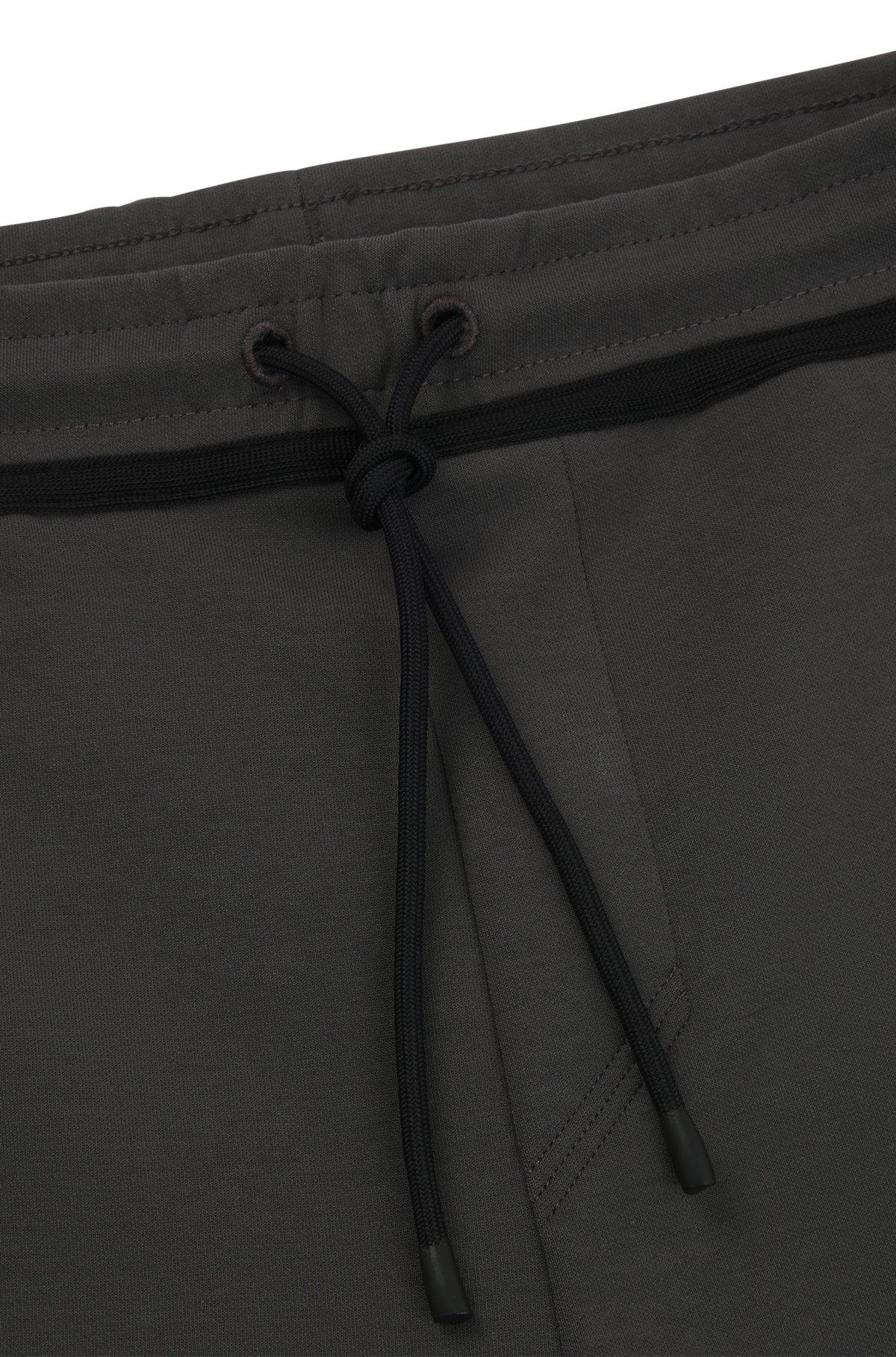 Tracksuit bottoms with tape and logo Product Image
