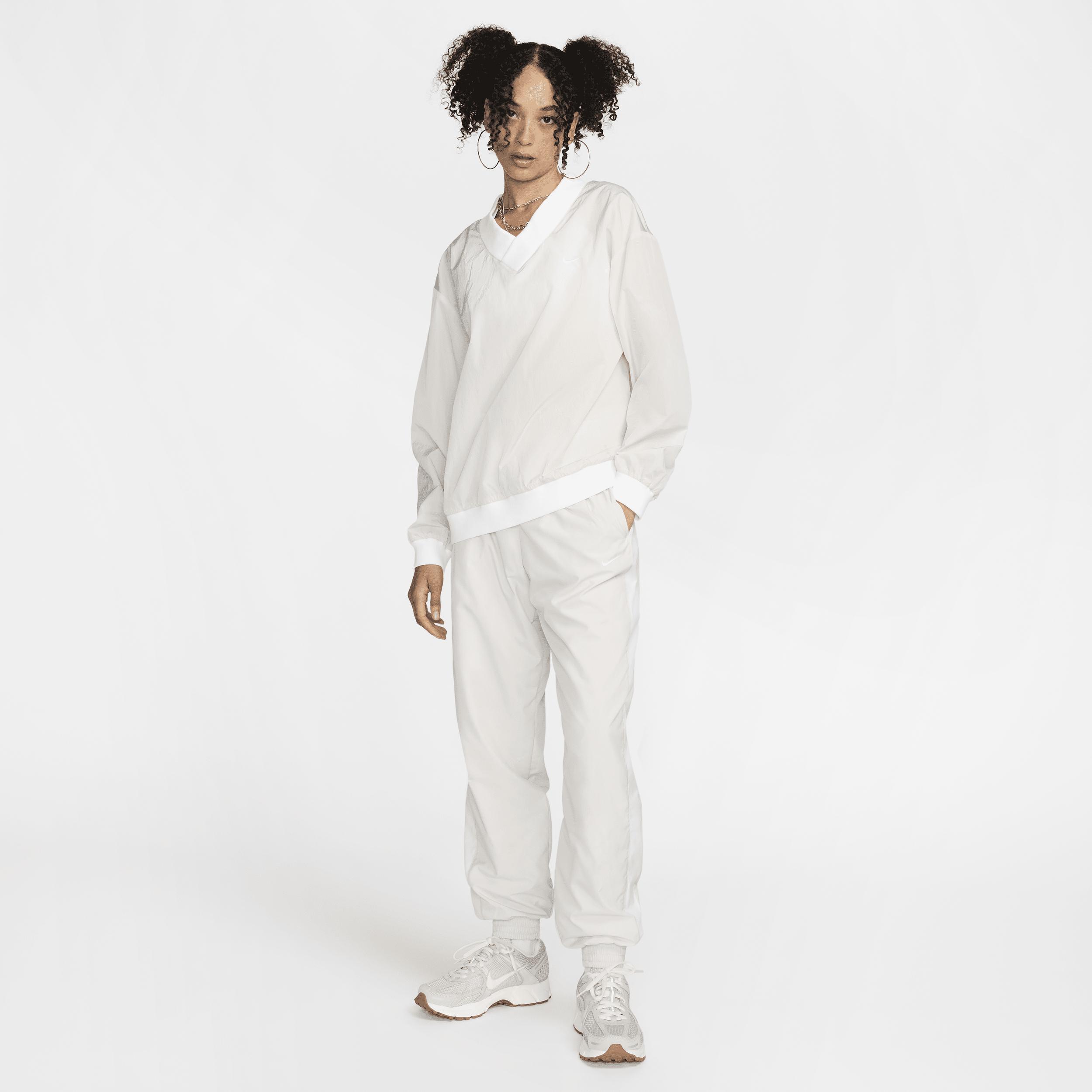 Womens Nike Sportswear Essential Loose UV Woven Long-Sleeve V-Neck Top | FV7649-110 Product Image