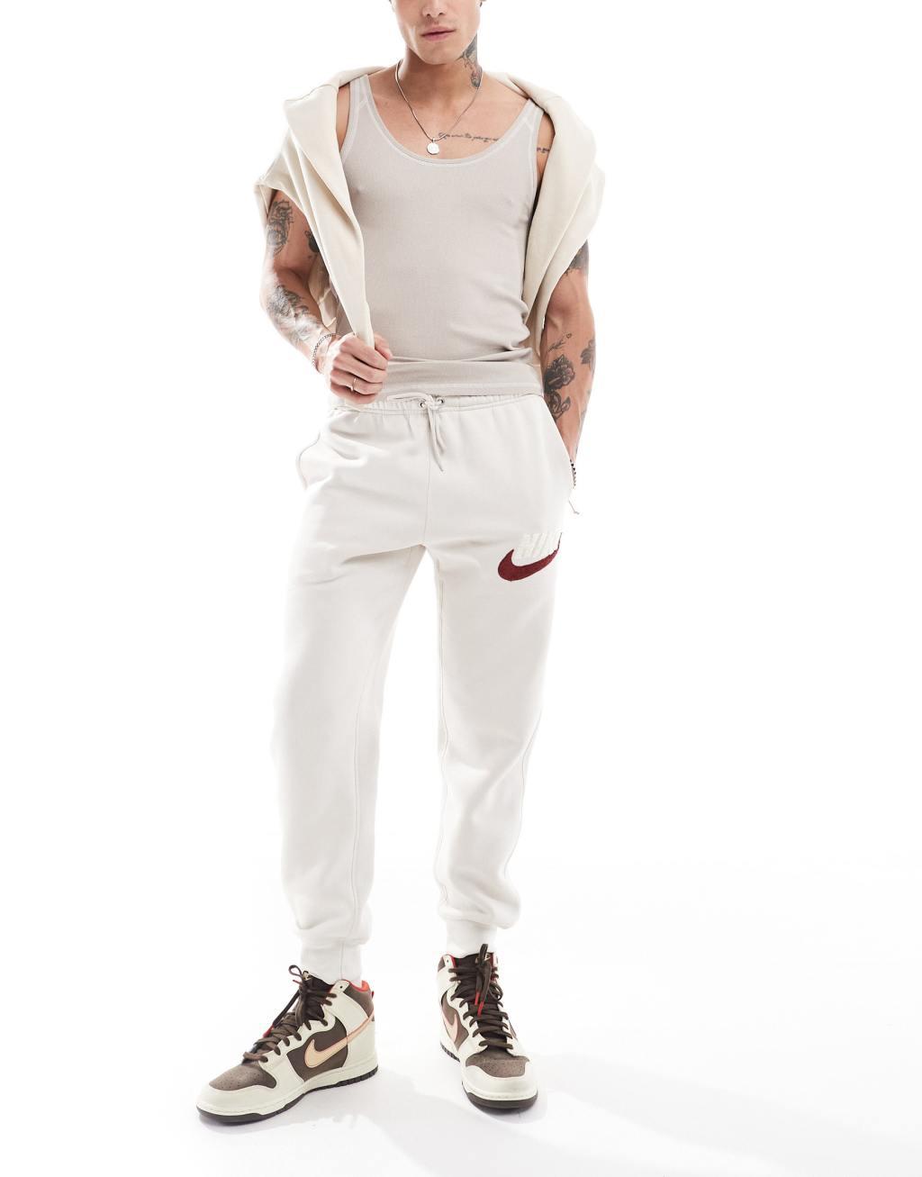 Nike Club Chenile Futura logo joggers in beige Product Image